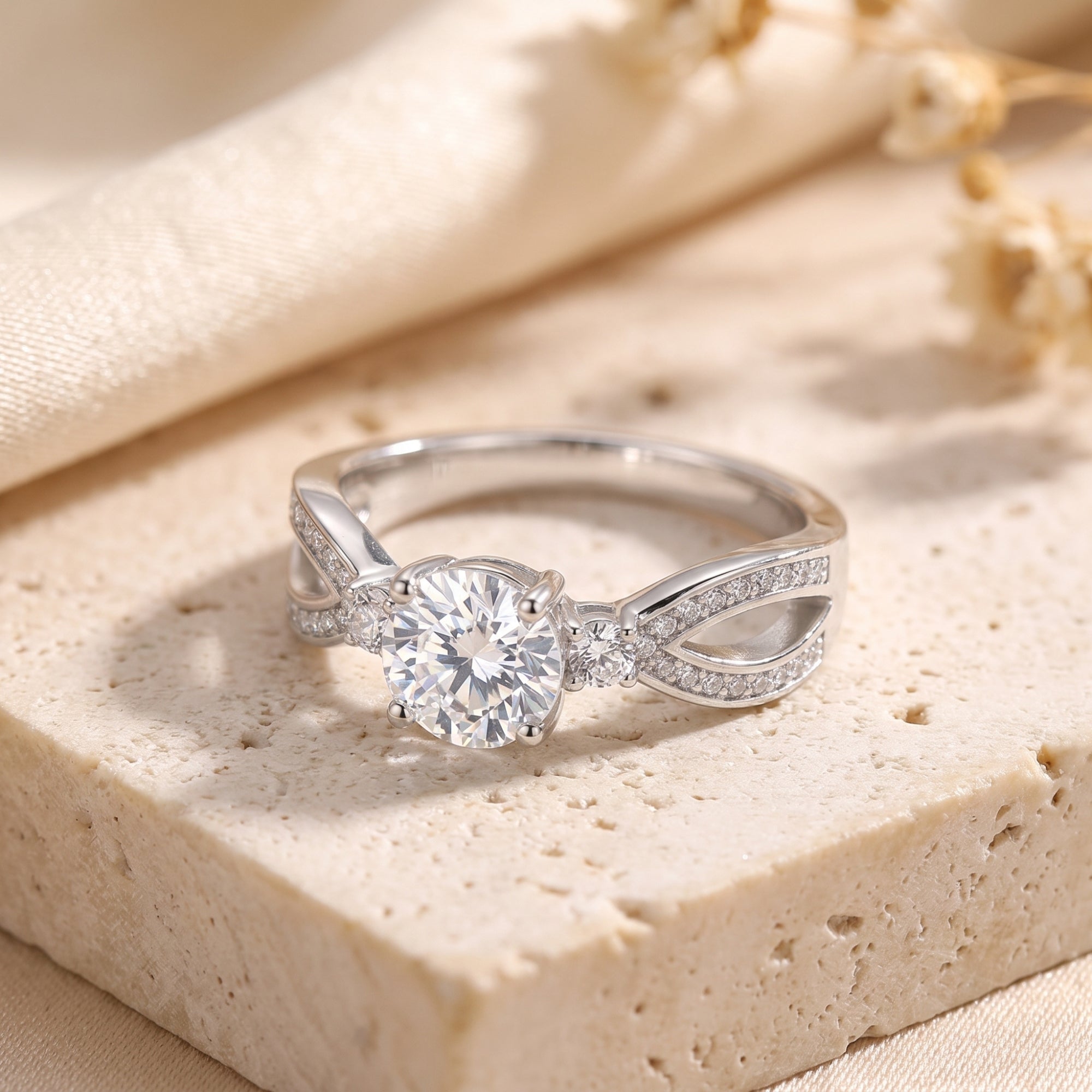 The Noeline sterling silver promise ring with a round brilliant cut simulated diamond on a textured stone base.