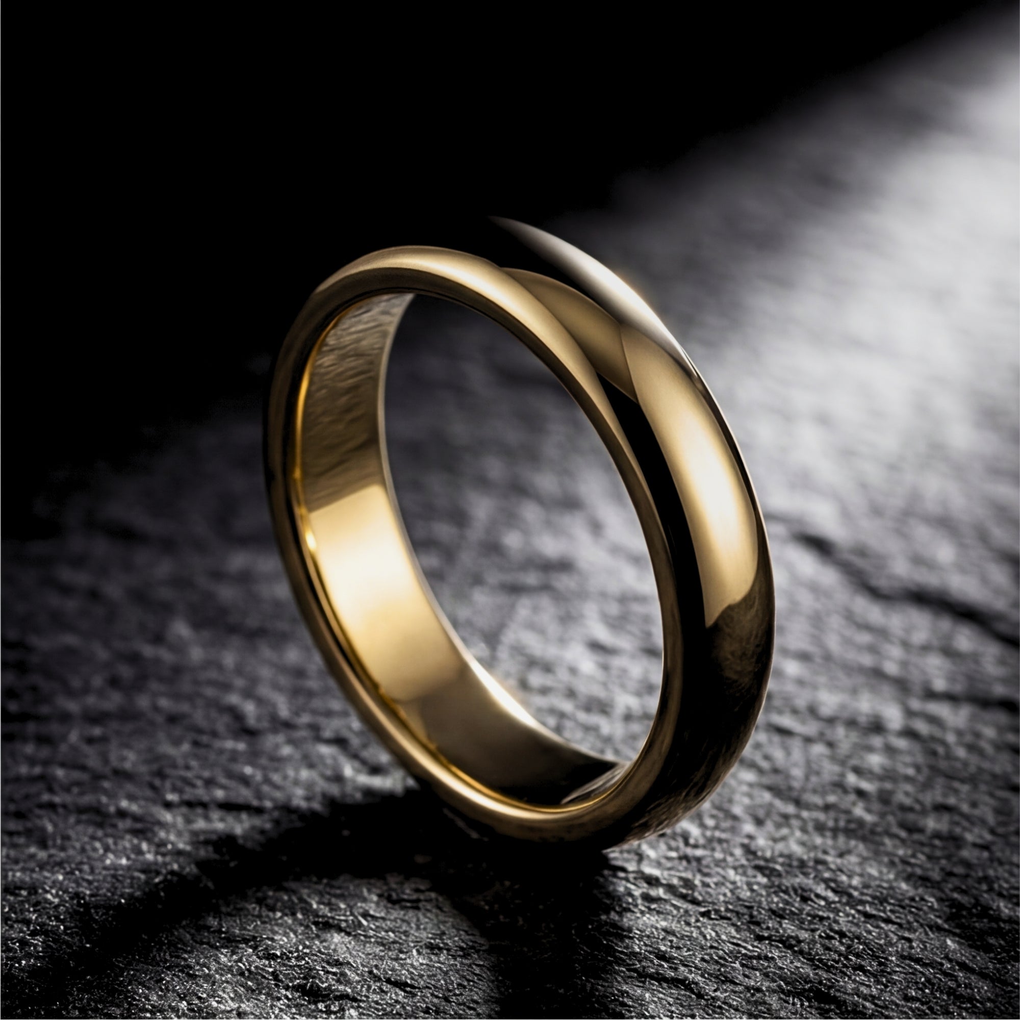 5mm gold tone stainless steel band ring standing on a dark, textured stone surface.