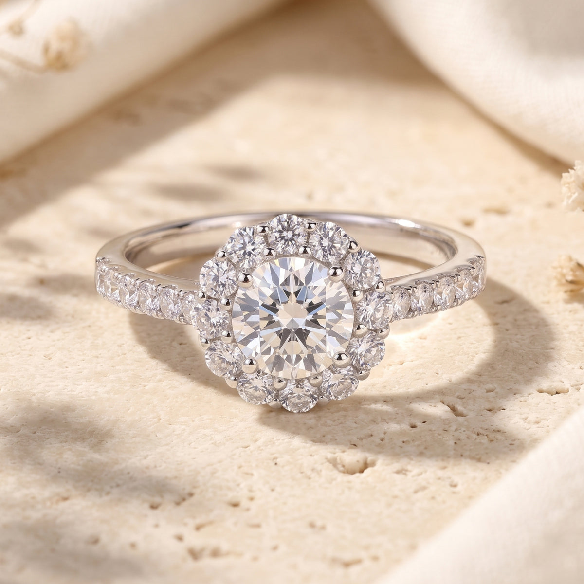S925 sterling silver Aurora Bloom floral halo promise ring with a round-cut center stone on a stone surface.
