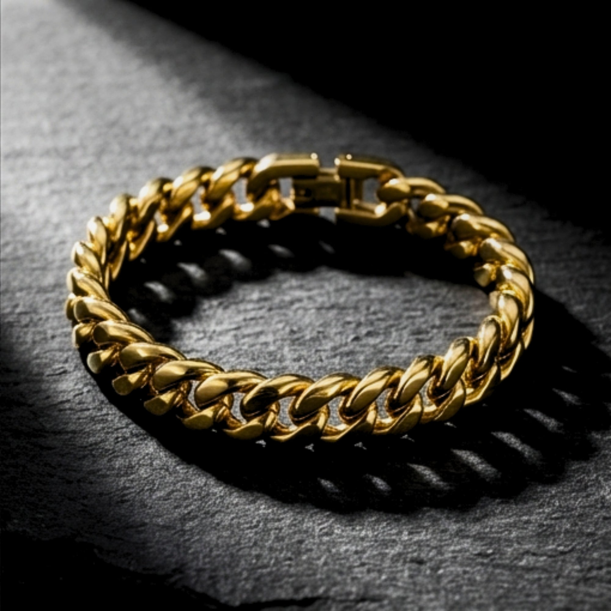 8mm gold stainless steel Cuban link bracelet shown from an angle on a dark textured stone surface.