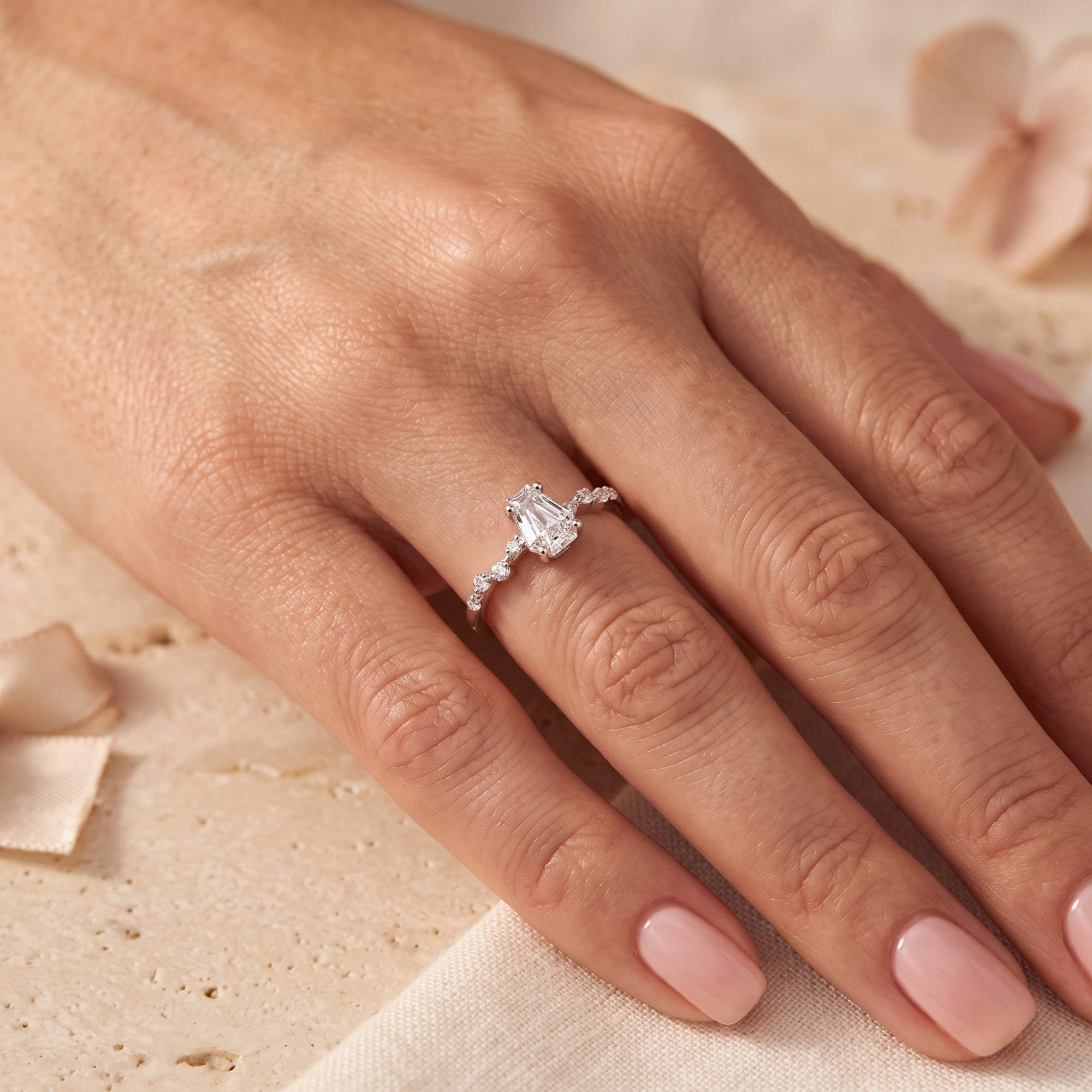 Rosmerta silver ring featuring a coffin-cut simulated diamond worn on a woman's hand.