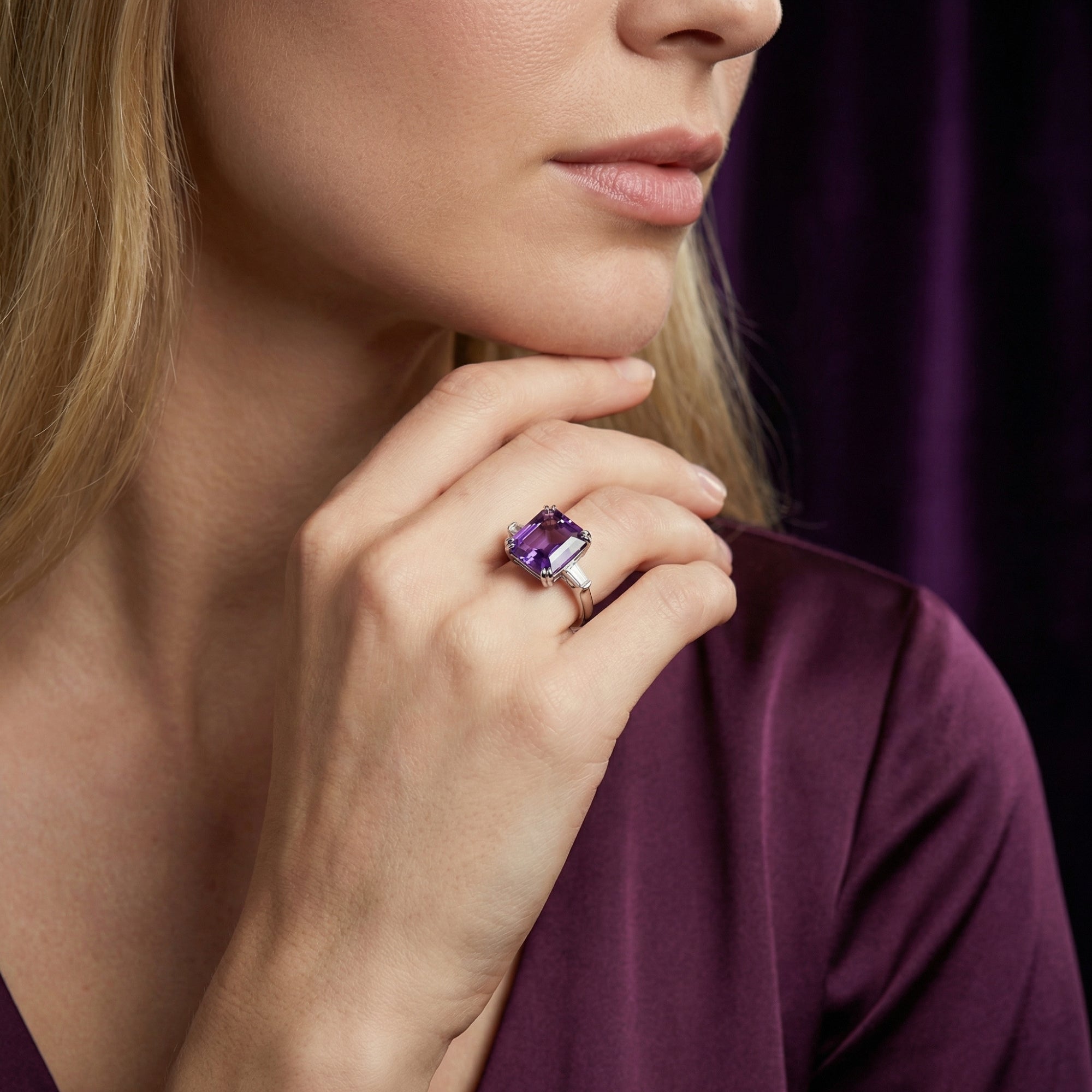 Woman wearing the Rosalina square cut amethyst ring in sterling silver on her finger.