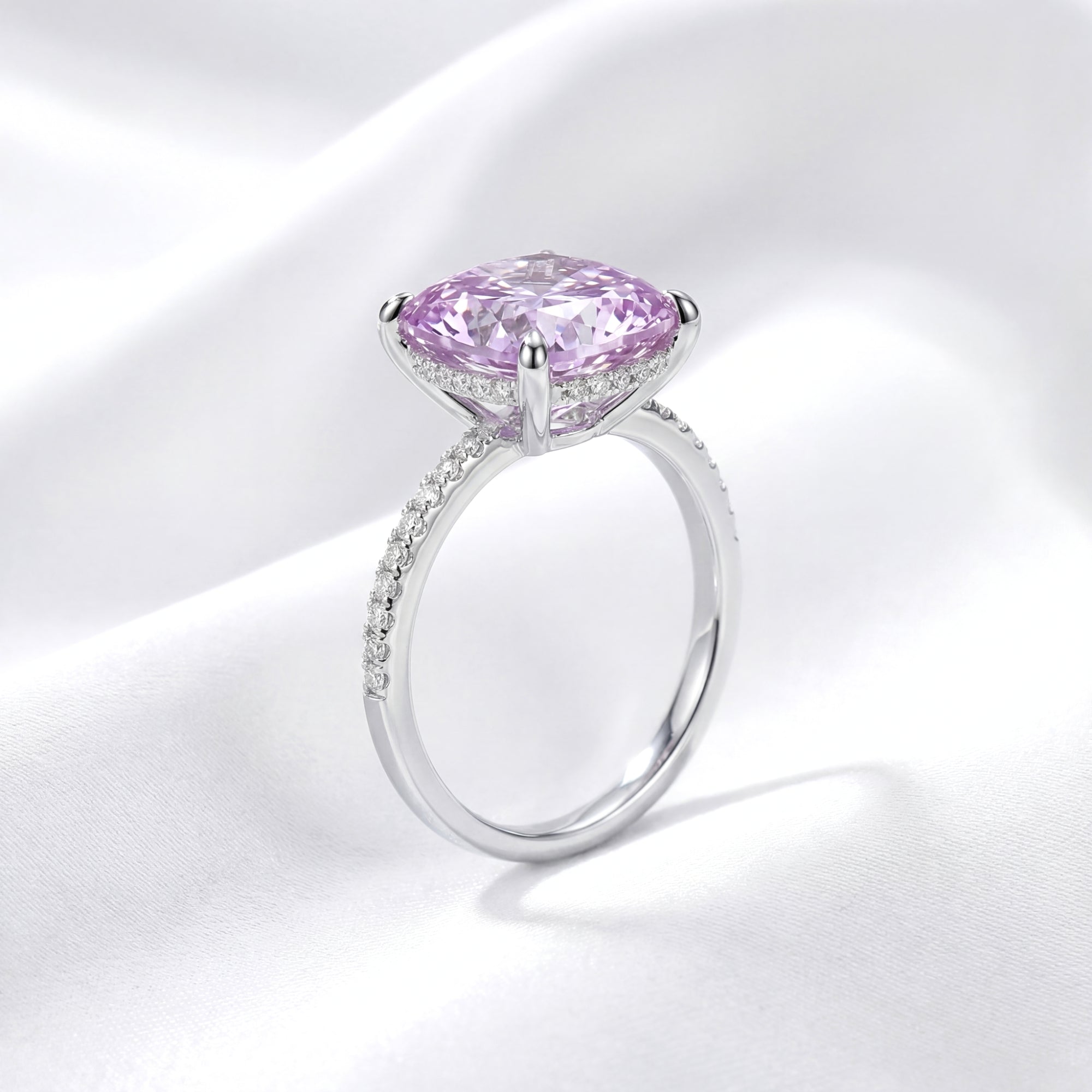 Side profile of the Ariadne halo ring with a cushion cut simulated amethyst and pavé sterling silver band.