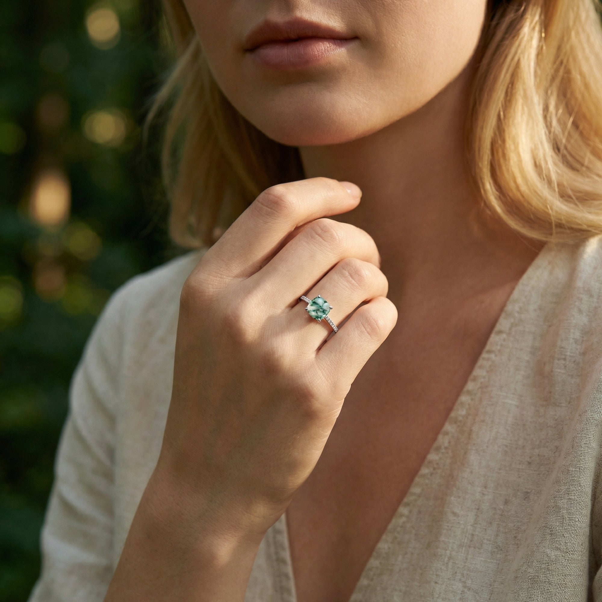 Model wearing the cushion cut natural moss agate pavé ring in S925 sterling silver on her finger.