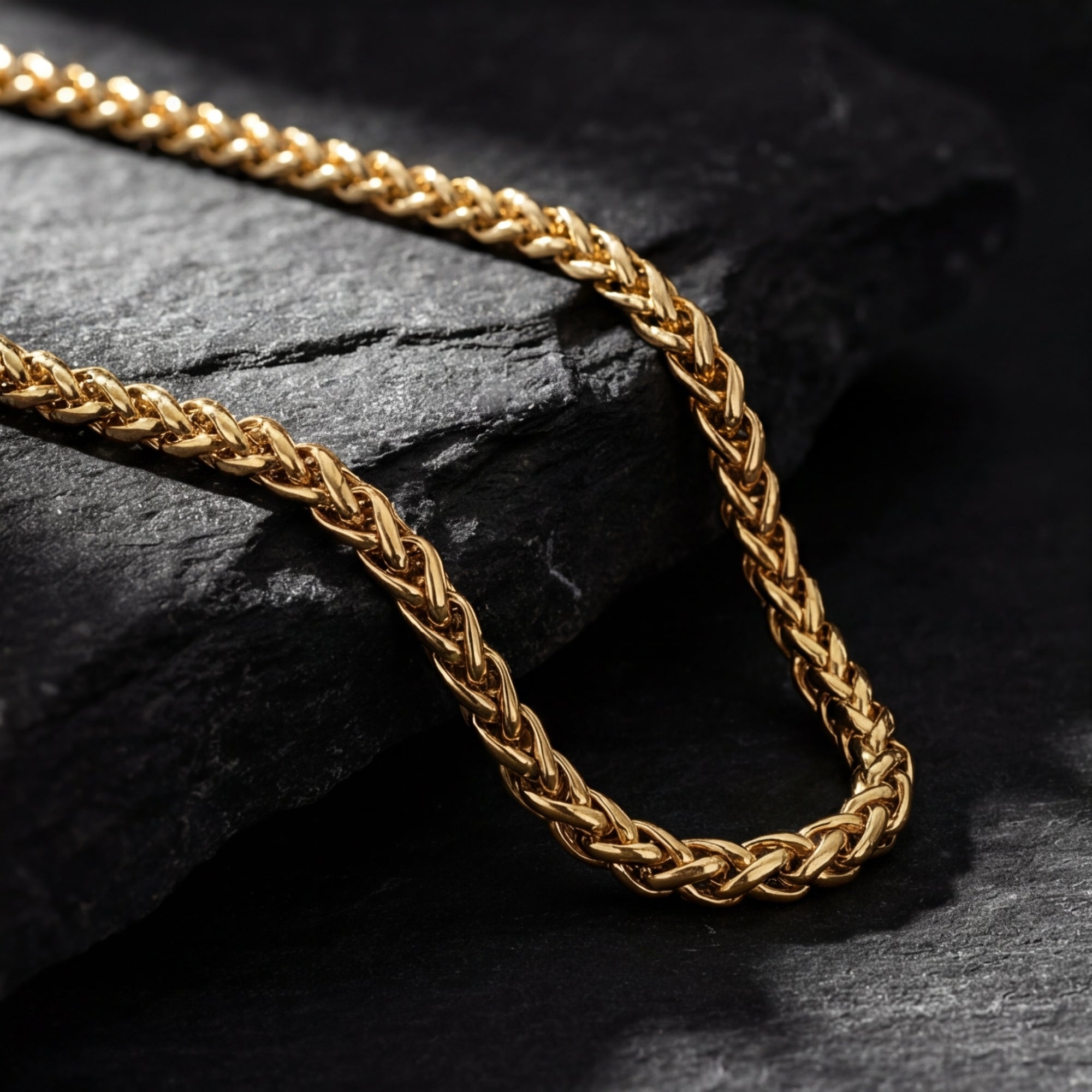 Close-up of the intricate links on a 6mm gold stainless steel wheatfield chain.