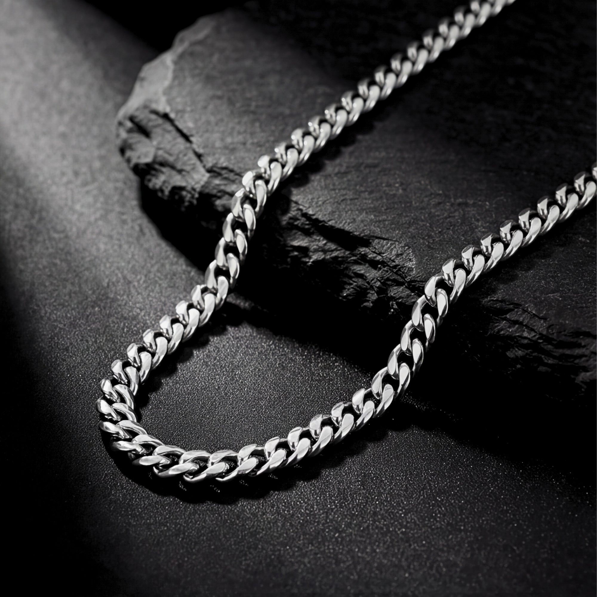 Close-up detail of the 6mm silver stainless steel links on the Origin 1 Cuban chain.