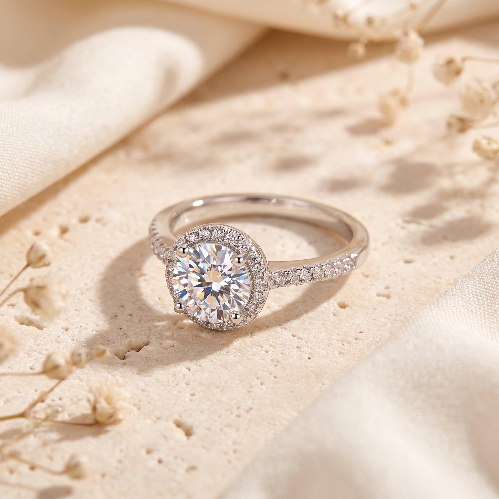 Angled view of the sterling silver Cassielle ring with a round-cut simulated diamond halo on stone.