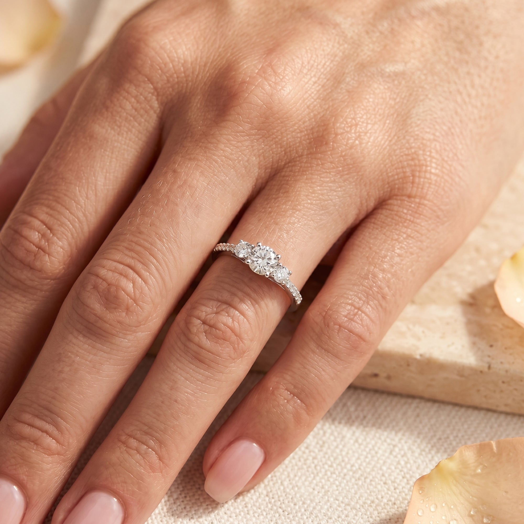 Top view of the sterling silver Roselysse ring with a round simulated diamond center stone worn on a hand.