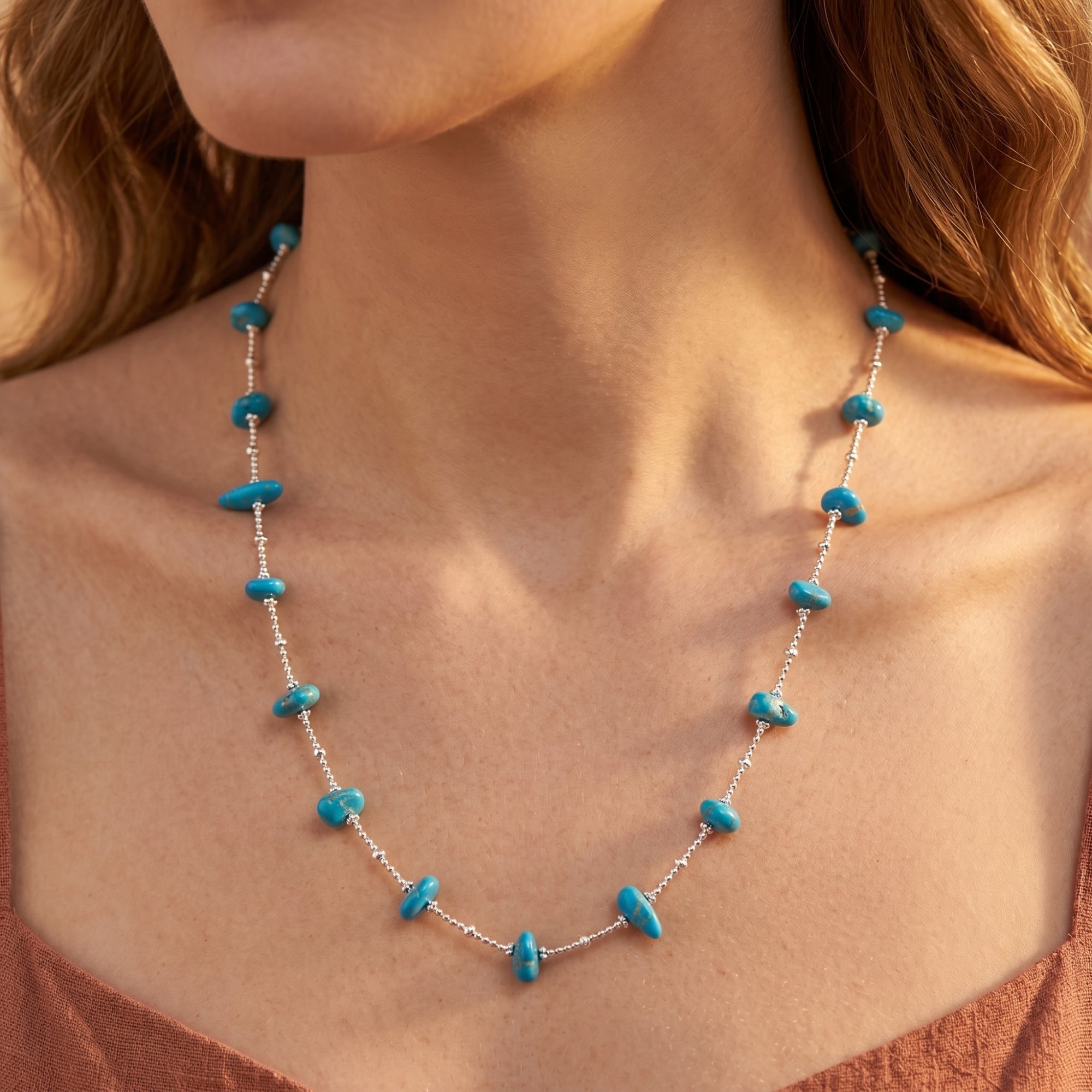 Model wearing the Gallup turquoise bead necklace in silver.