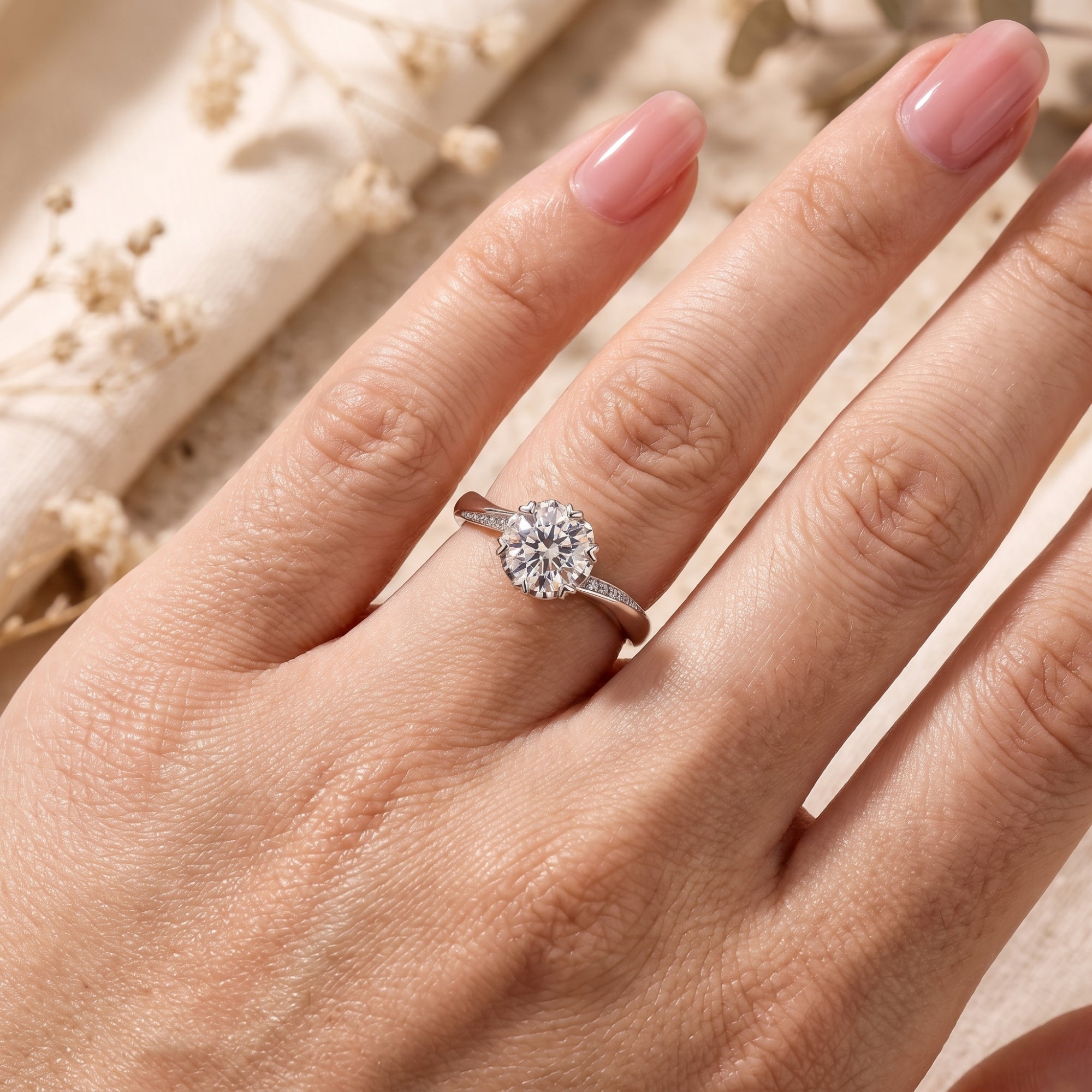 Silver Liorabelle ring with 6.5mm round simulated diamond on finger for scale.