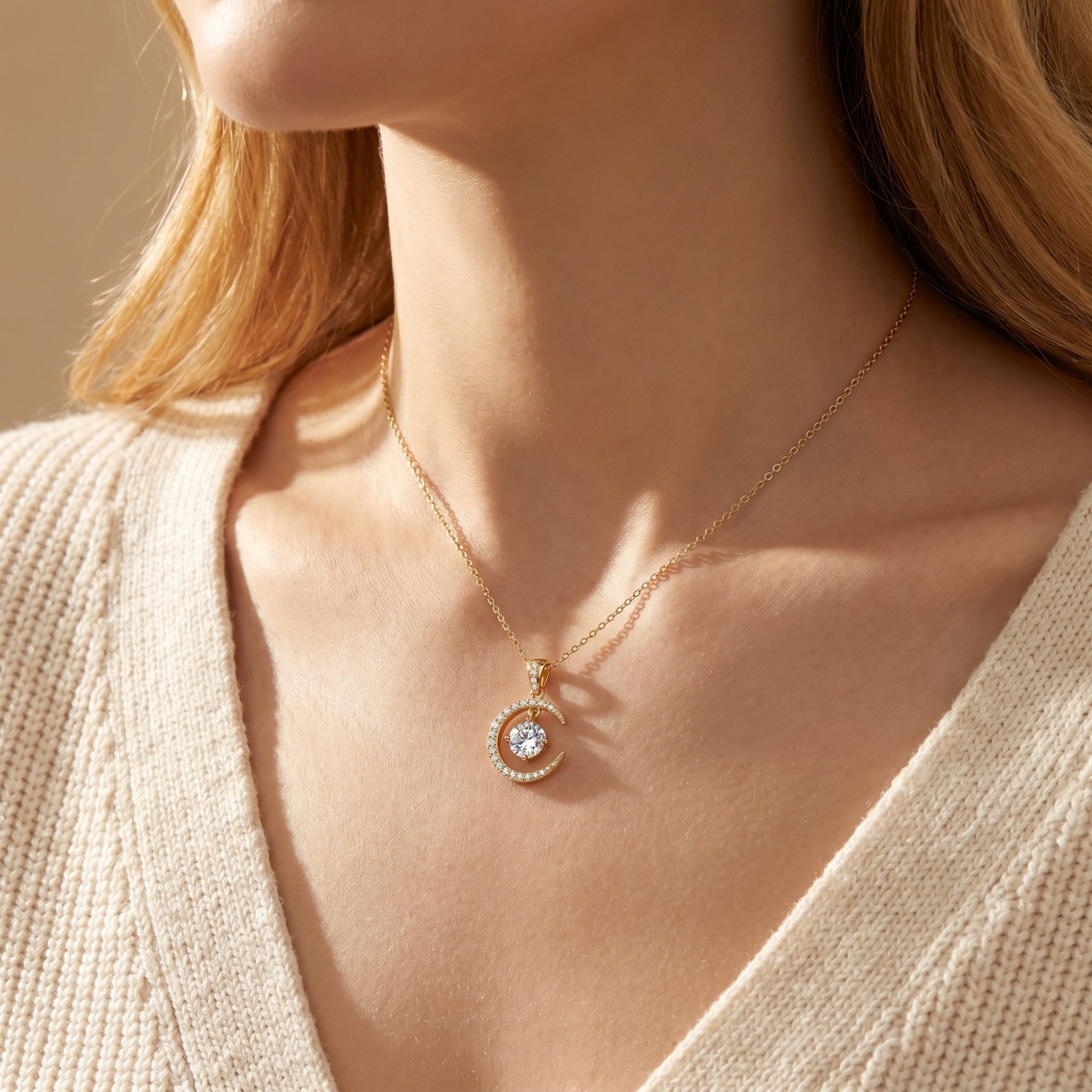 Model wearing the gold vermeil moissanite crescent moon pendant necklace.