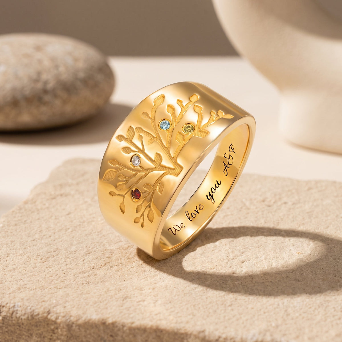 Detailed branches of the solid gold family tree ring with simulated birthstones.