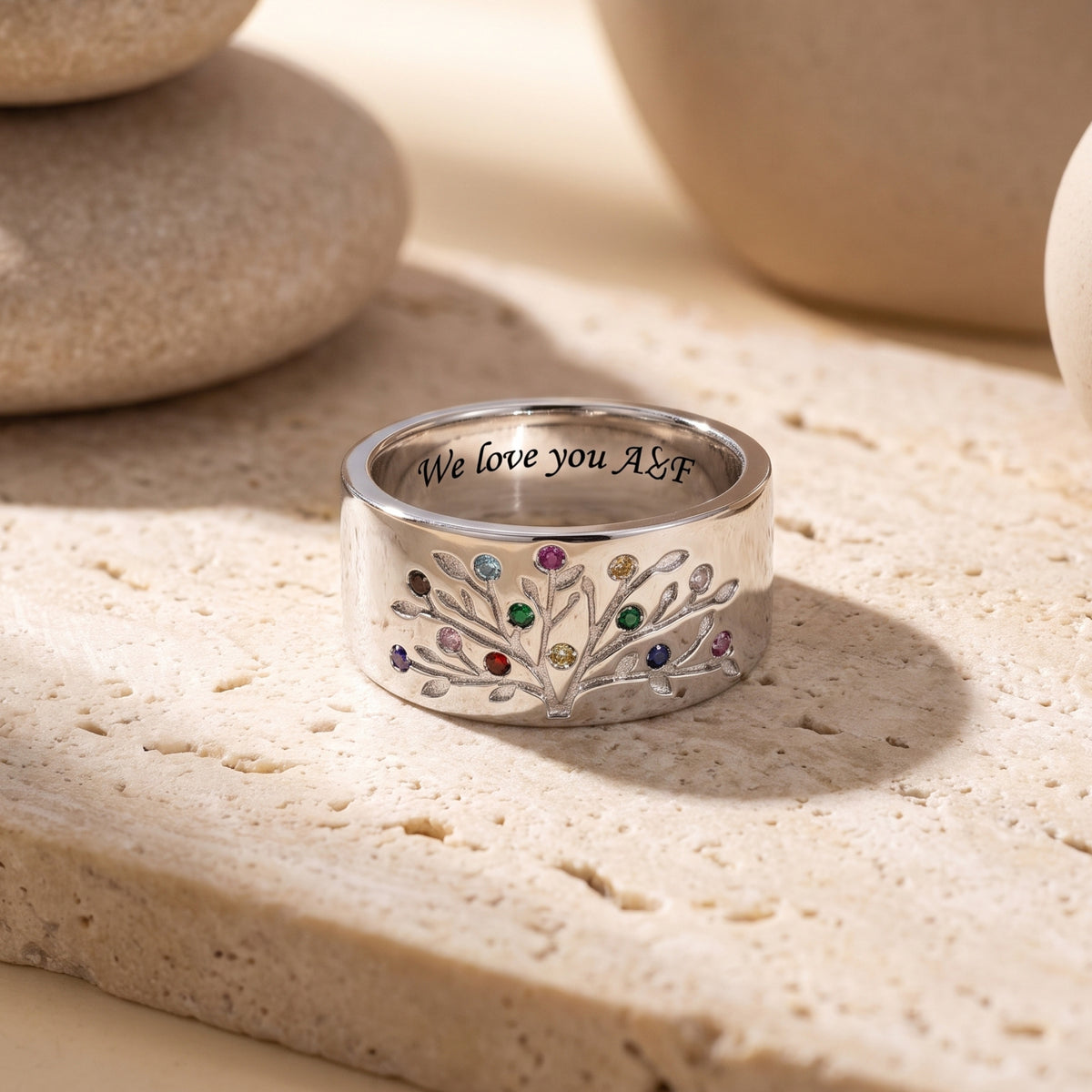 Solid gold family tree ring with customizable simulated birthstones.