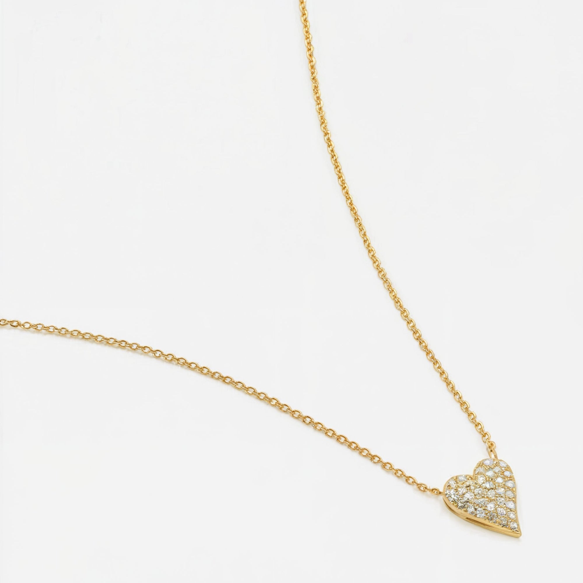 An 11mm by 15mm lab-grown diamond heart pendant on a gold necklace.