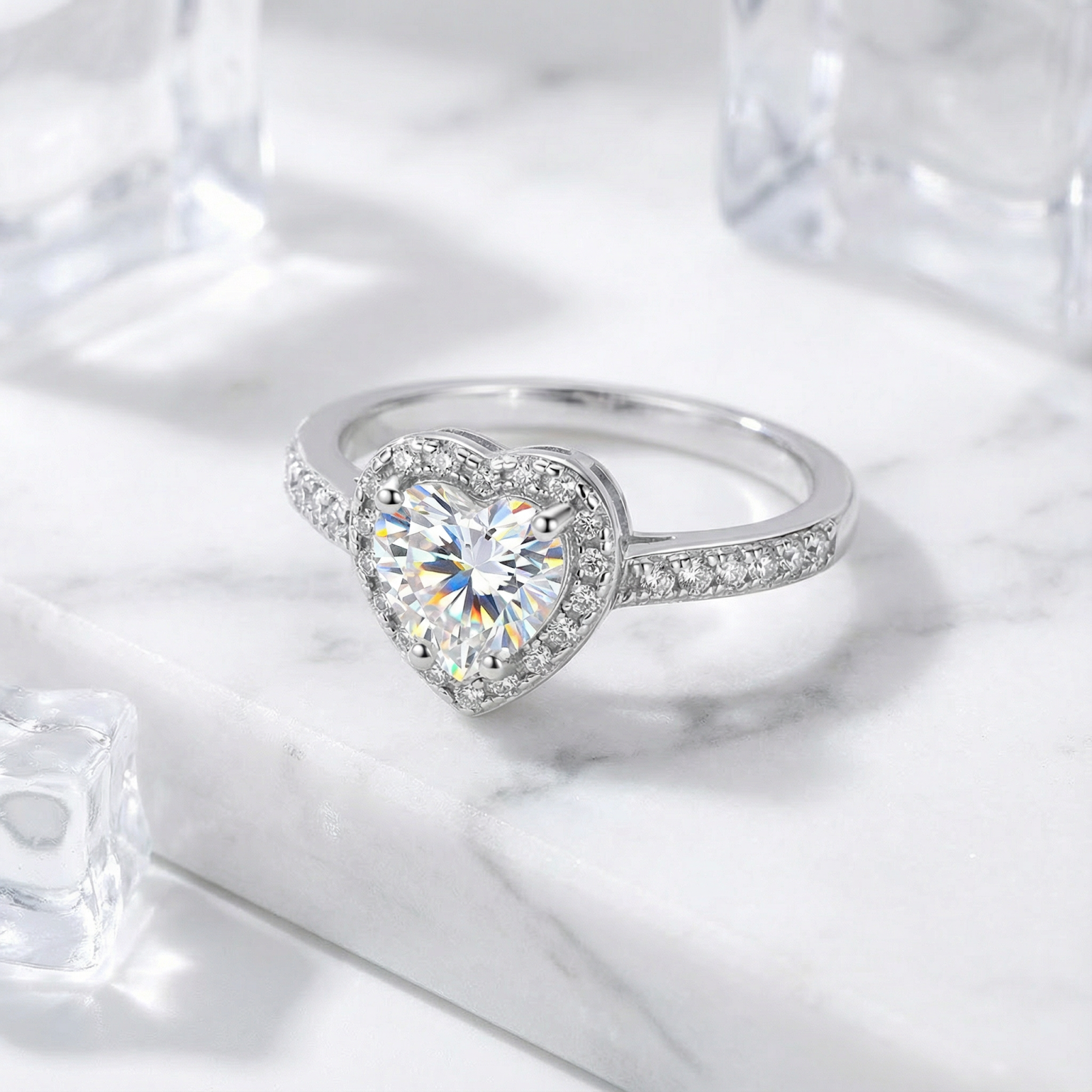 Angled view of the Seraphina heart-shaped simulated diamond ring in sterling silver on marble.