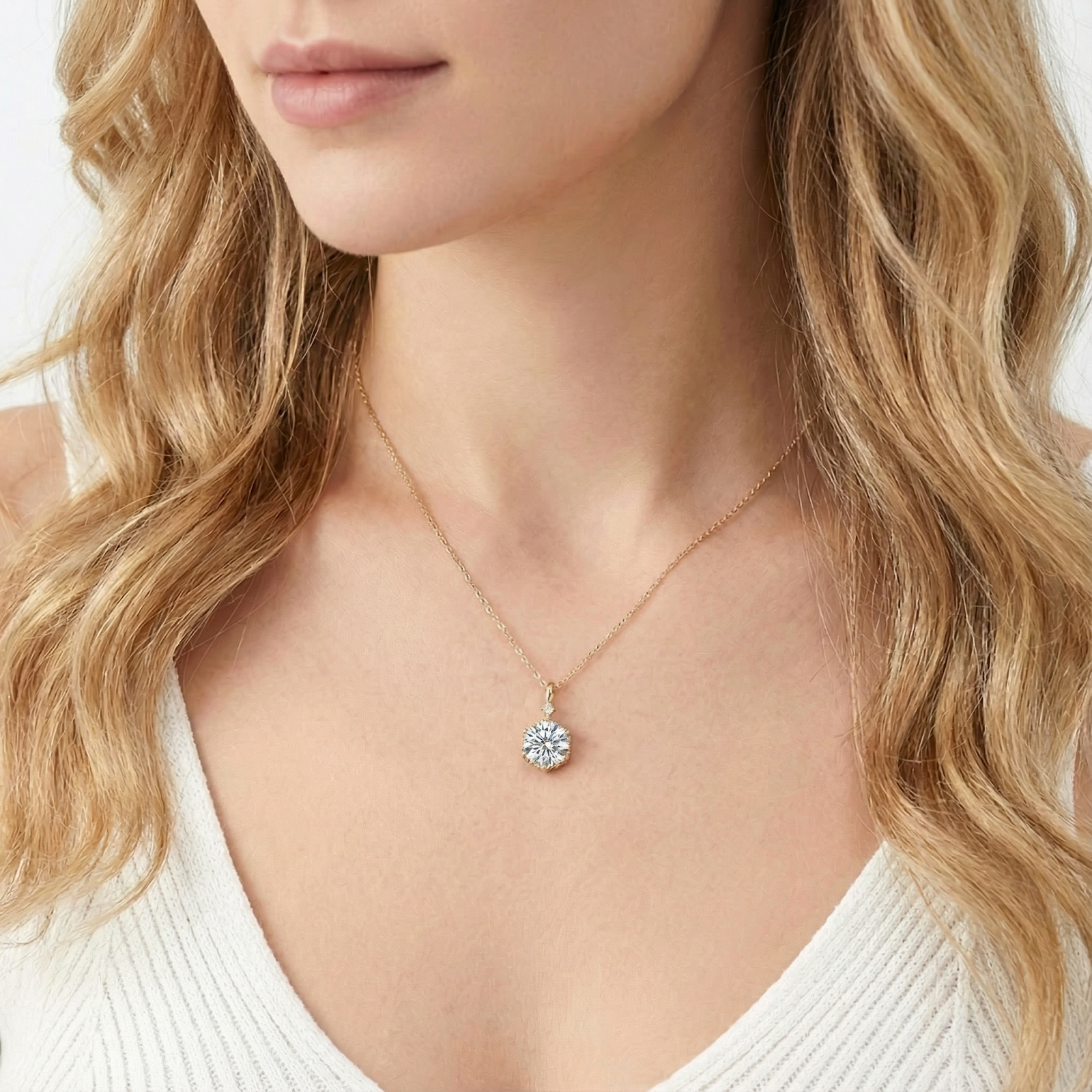 Model wearing the Hexa Radiant 18K gold vermeil necklace featuring a round simulated diamond pendant.