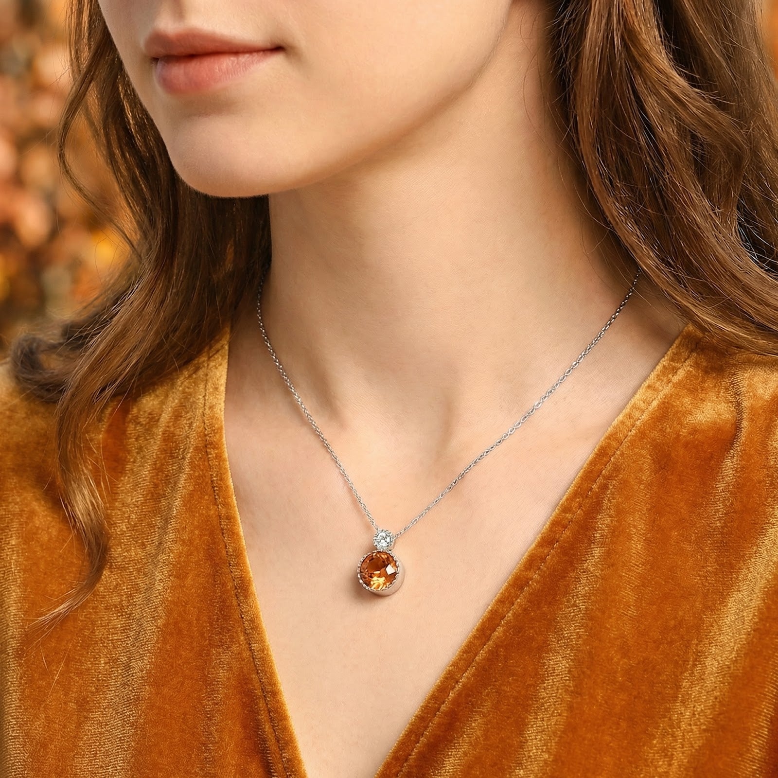 Model wearing the Lyranise Drop simulated topaz necklace in sterling silver with an adjustable chain.