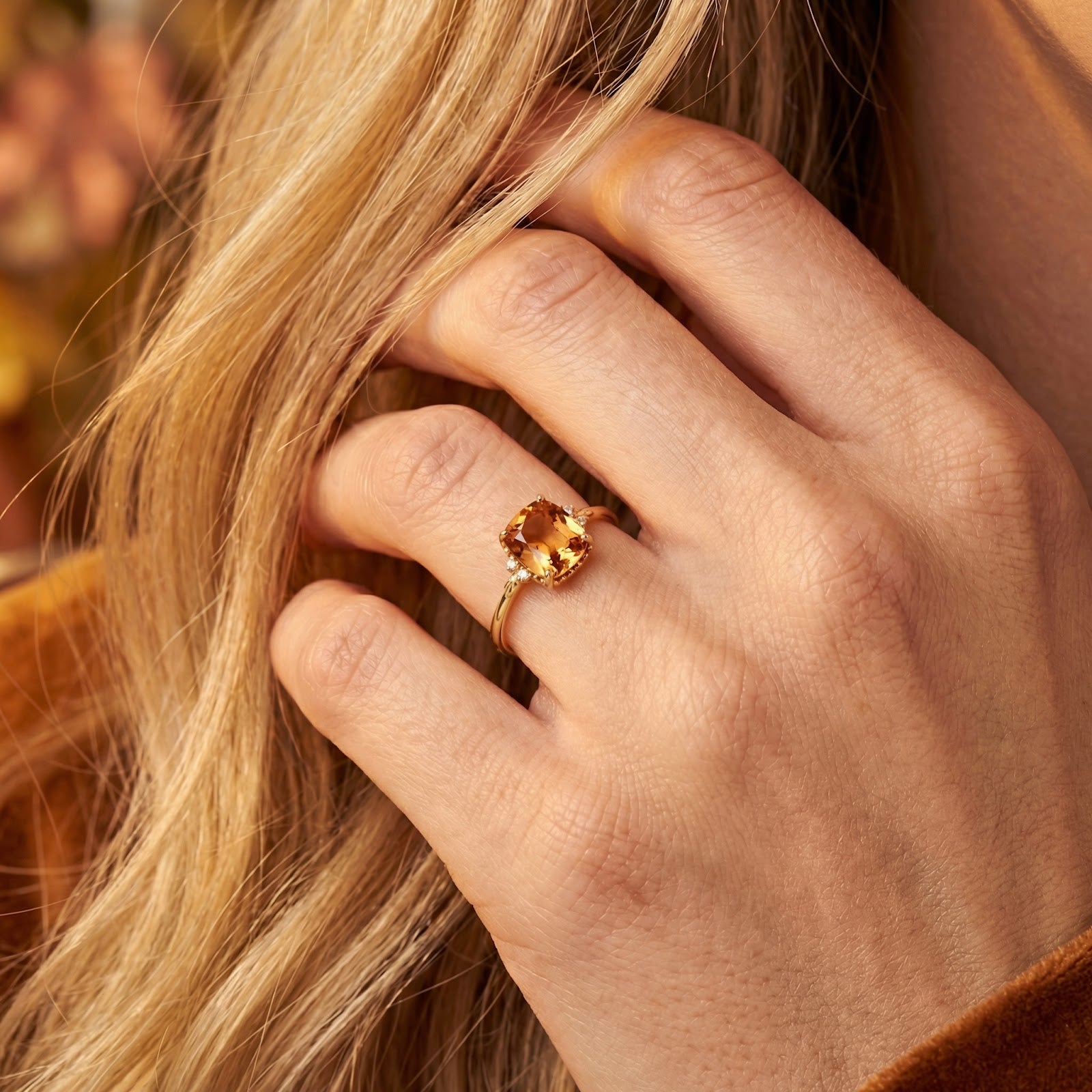 Model wearing the Calysienne cushion-cut simulated topaz ring in 18K gold vermeil on her hand.