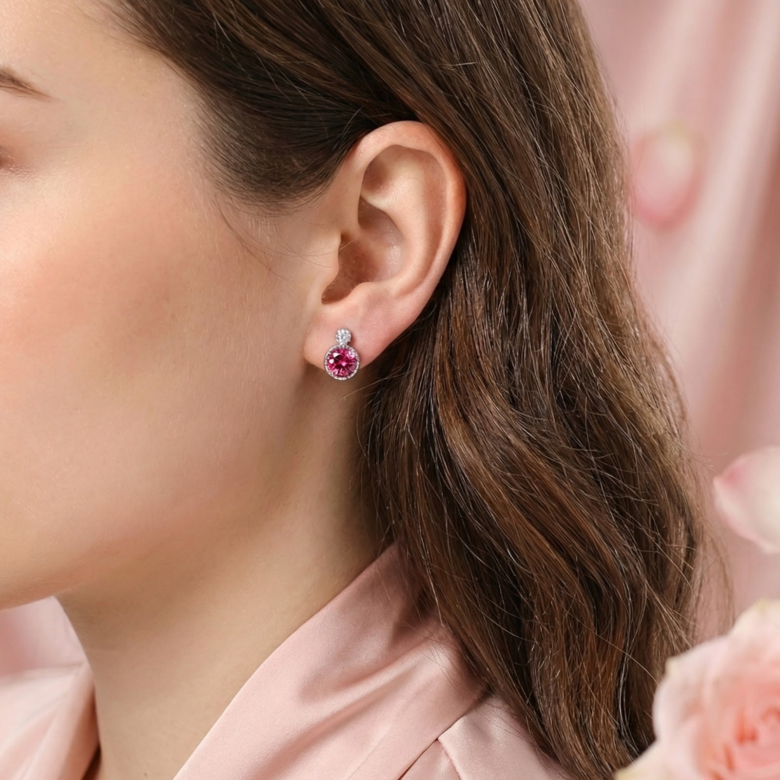 Model wearing a round simulated pink tourmaline stud earring in sterling silver platinum vermeil.