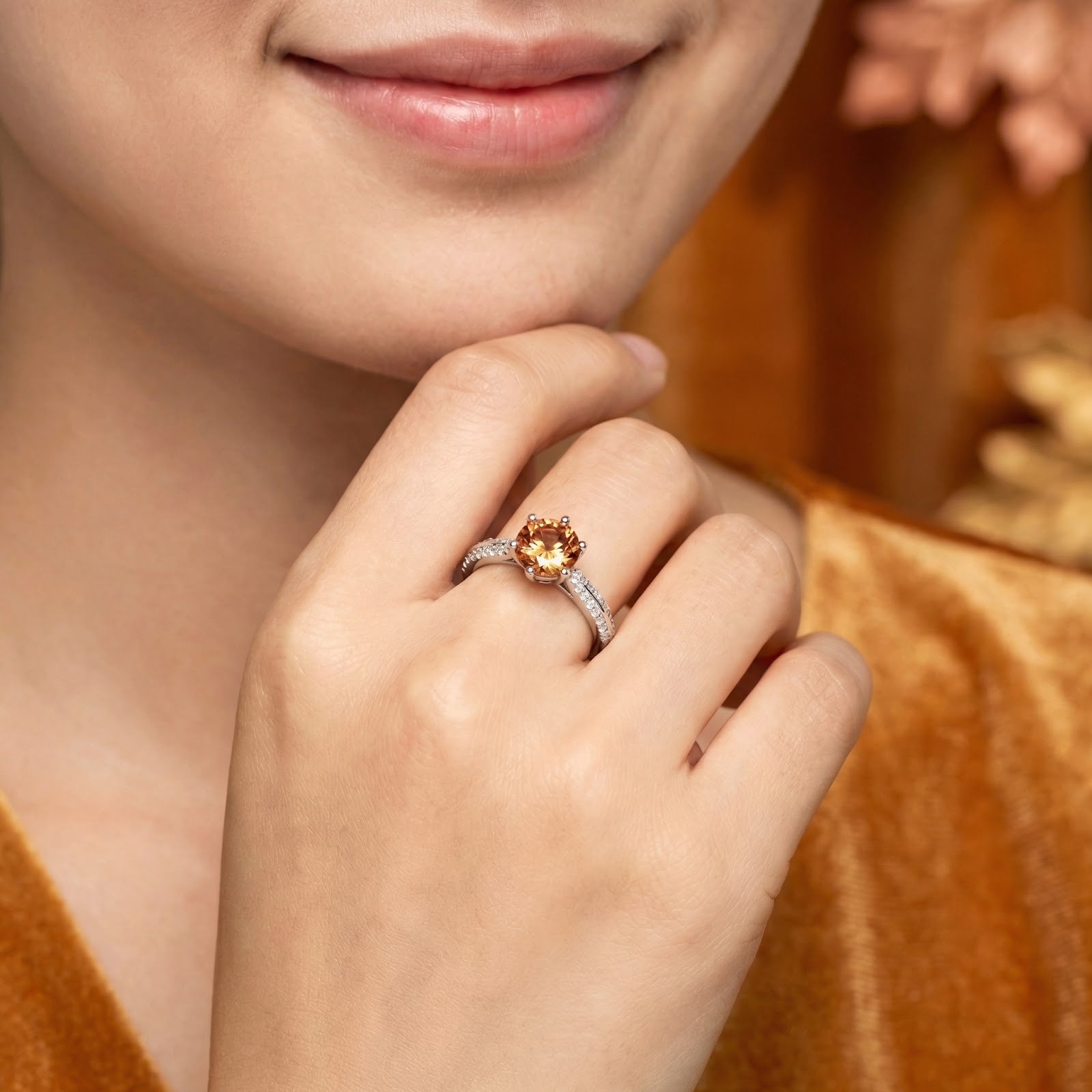 Model wearing the round simulated topaz sterling silver ring on her finger, showcasing its size and brilliance.