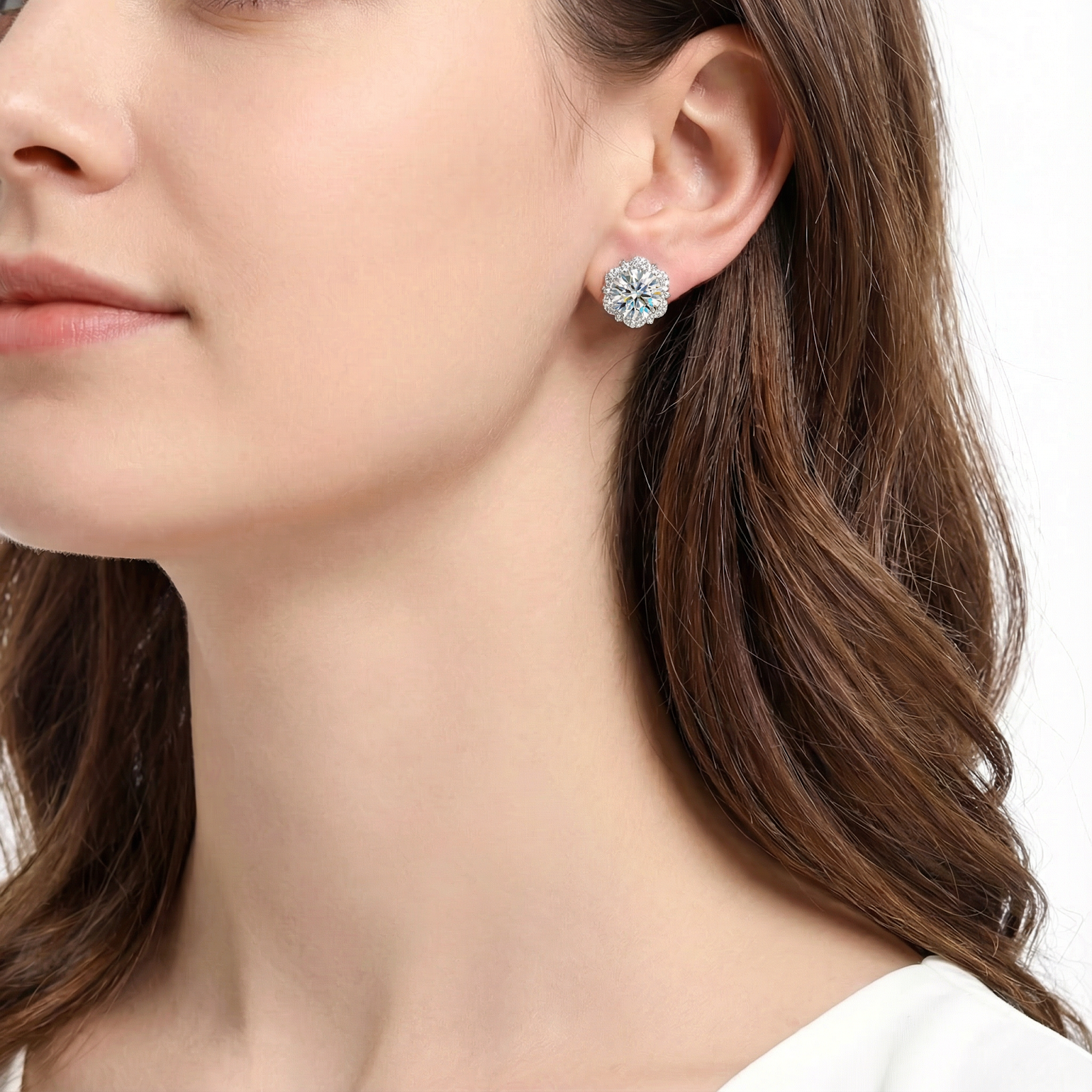 Model wearing the April birthstone Isolde halo stud earrings in S925 sterling silver with round stones.