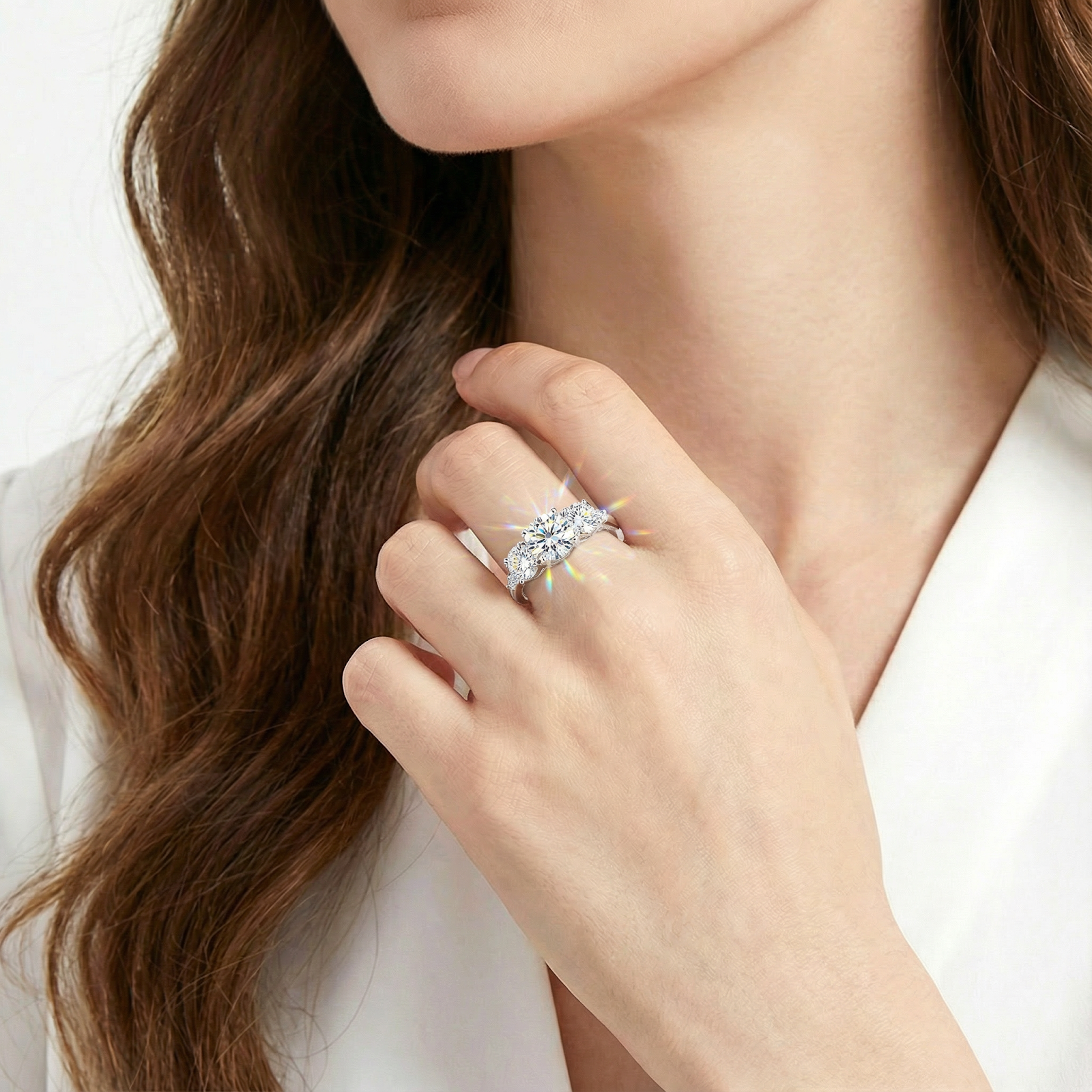 Model wearing the Elianne S925 sterling silver ring with sparkling round cut zirconia stones on her ring finger.