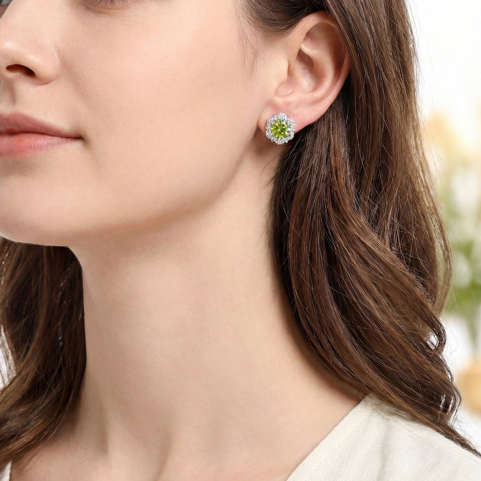Side profile of a model wearing the August birthstone S925 sterling silver simulated peridot blossom earrings.