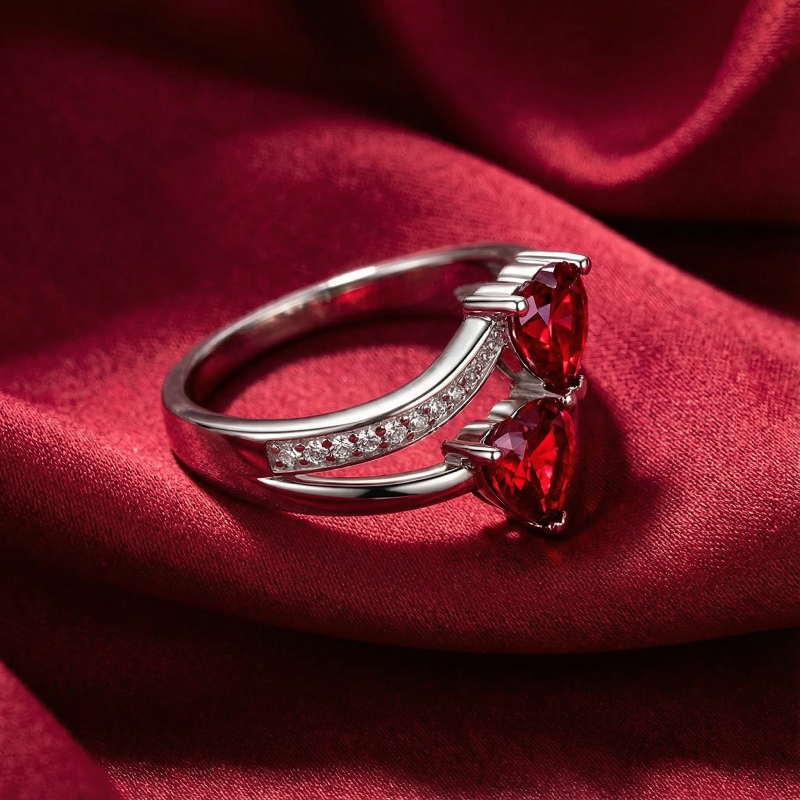 Side profile of the Elianara S925 sterling silver ring featuring heart-shaped simulated rubies and pave accents.