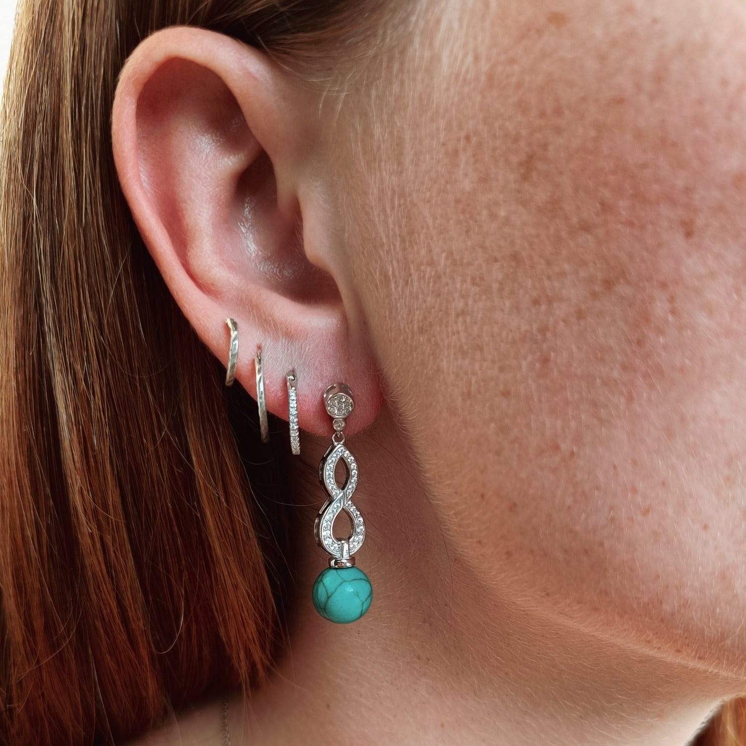 Azure Oceanic Earrings featuring turquoise stones in a sterling silver setting