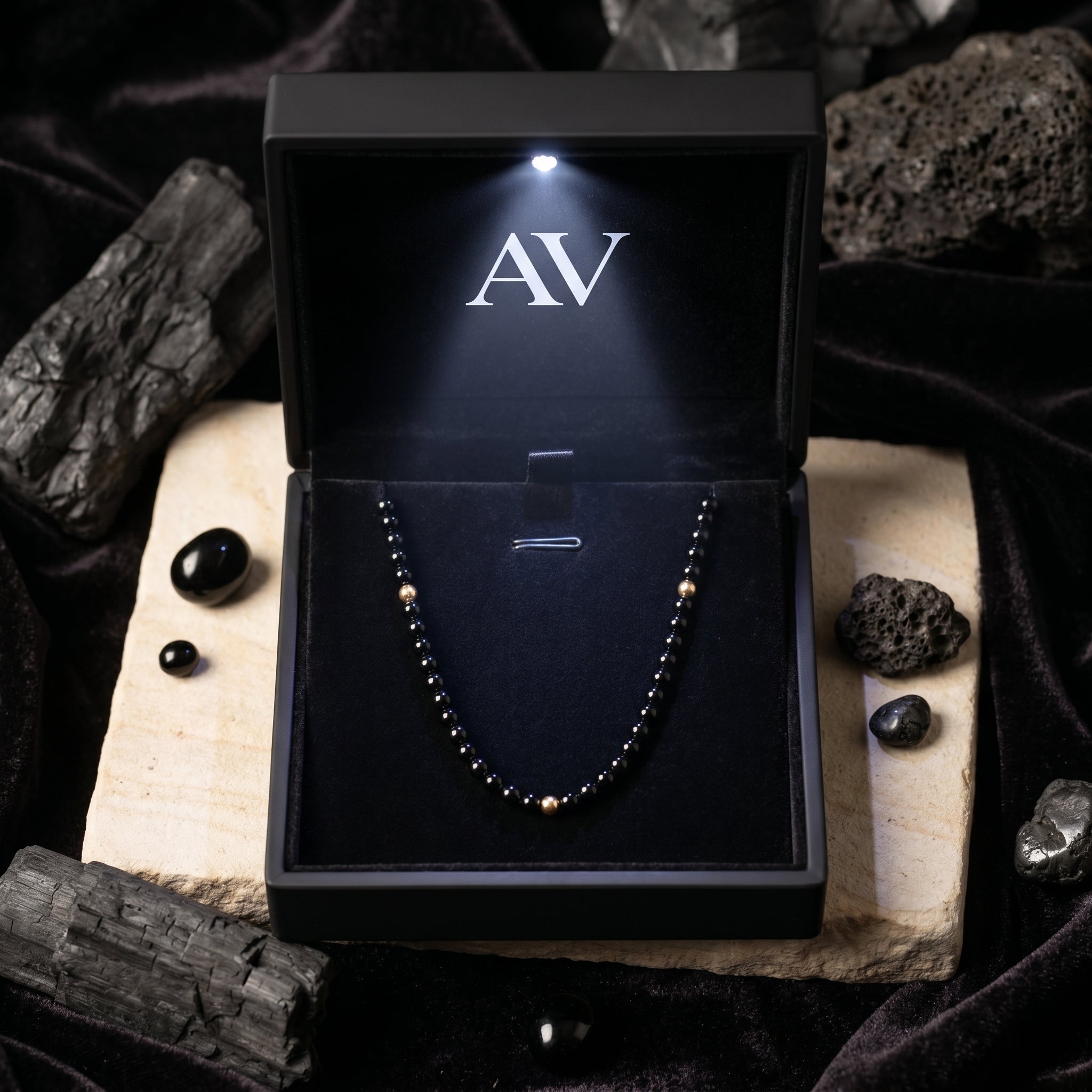 3mm polished black onyx bead necklace with 18K gold accents presented in a luxury black LED-lit jewelry gift box.