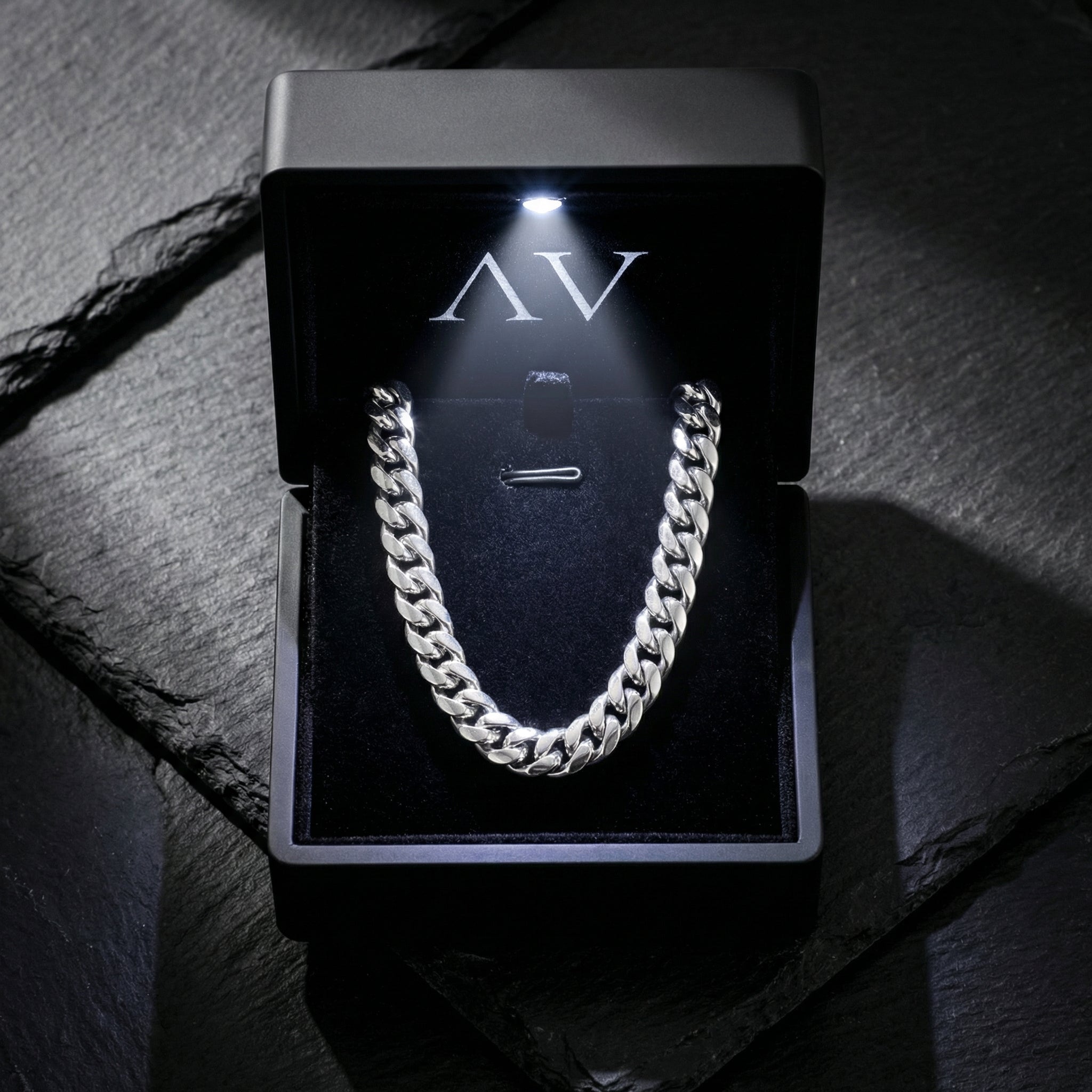 10mm silver stainless steel Cuban link chain inside a premium black LED-lit jewelry gift box.