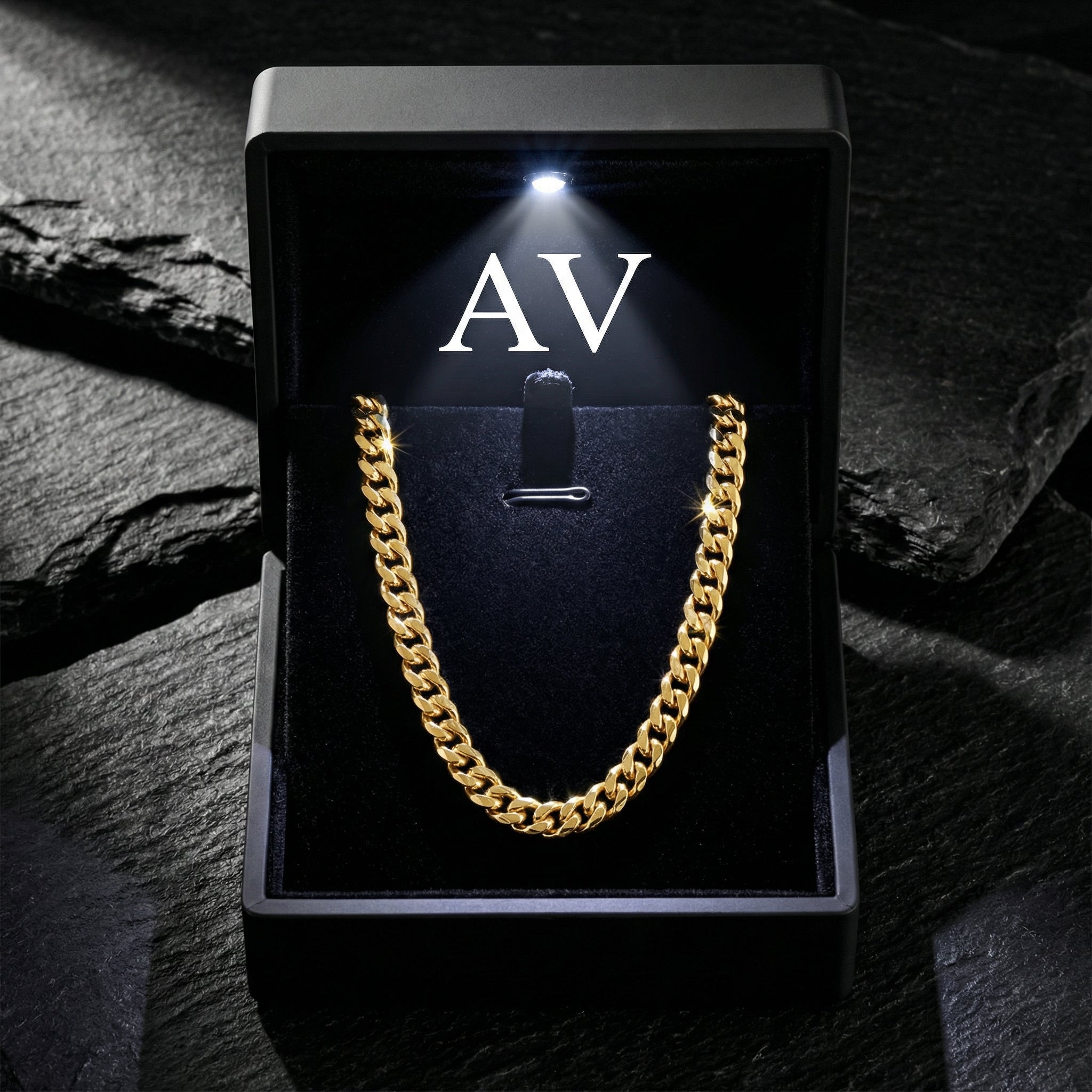Gold stainless steel Cuban chain presented in a premium black LED-lit gift box with AV branding.
