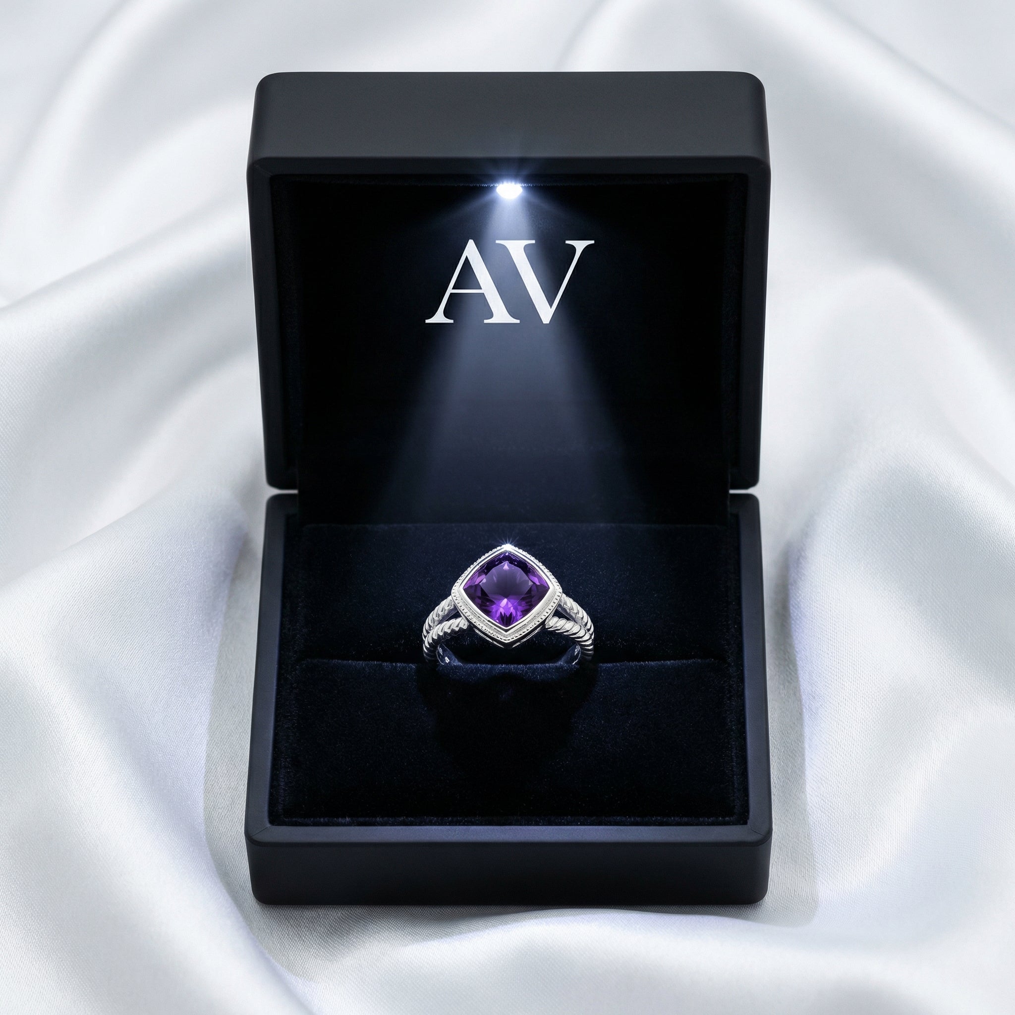 S925 sterling silver simulated amethyst ring inside a black LED-lit jewelry box on white silk.