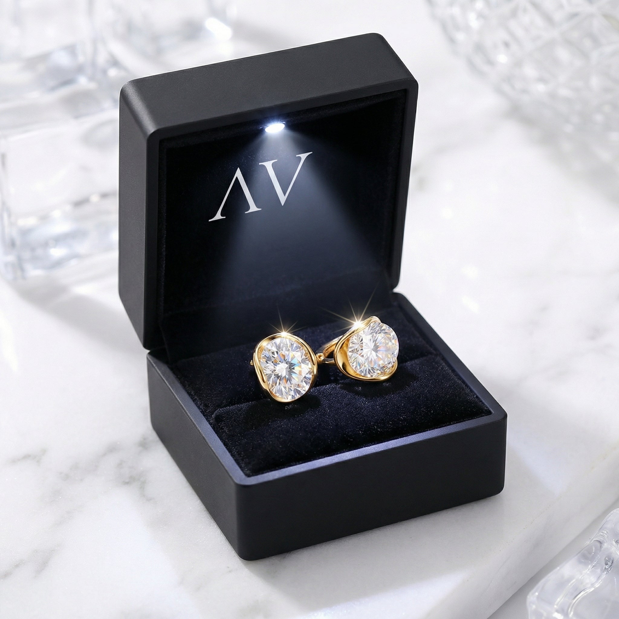 The Alysse Oval 18K gold vermeil earrings presented in a premium black LED lighted jewelry gift box.