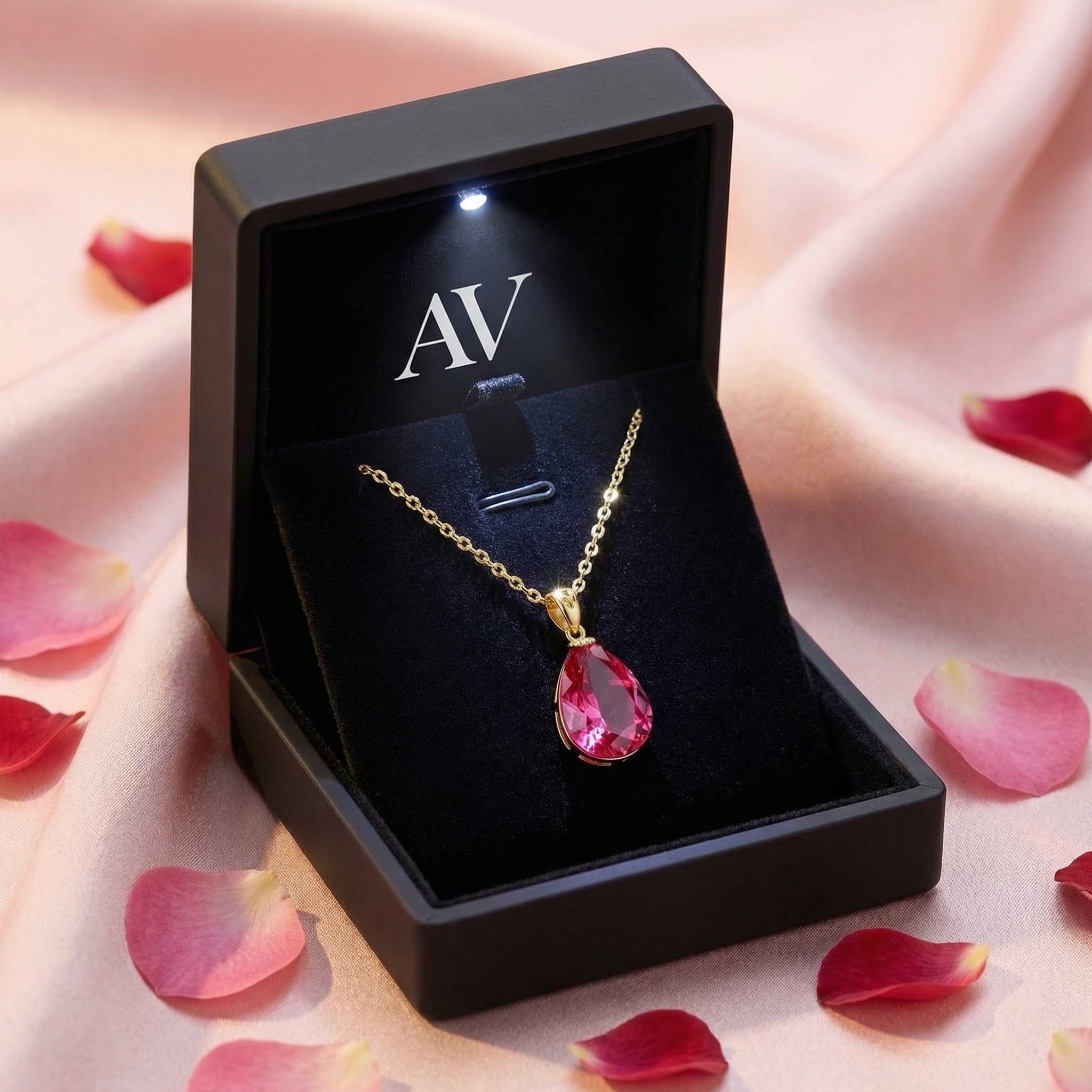 Pear-cut simulated pink tourmaline necklace in 18K gold vermeil inside a lighted black AV gift box.