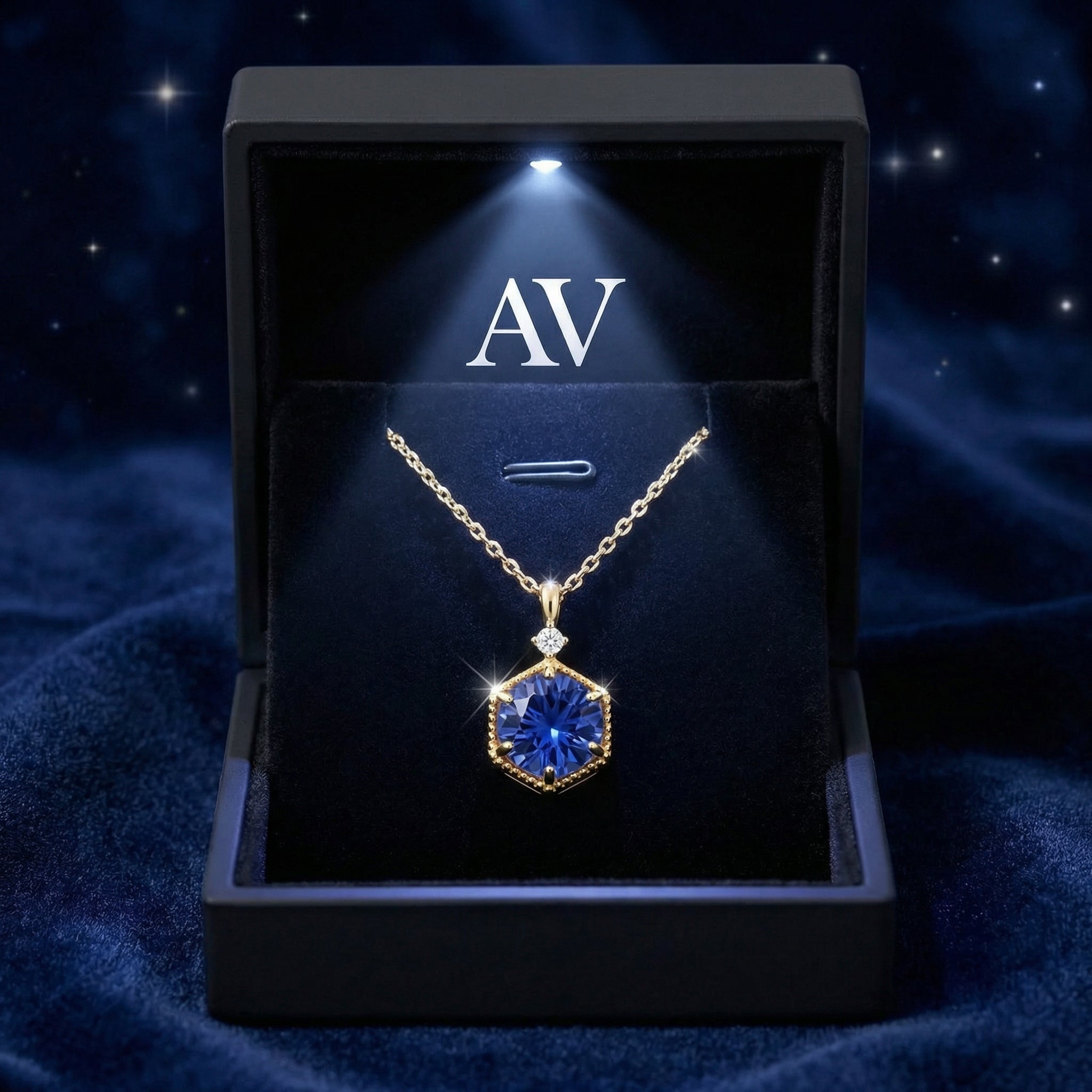 Royal blue simulated sapphire hexagon necklace in a premium LED-lit black jewelry gift box with AV branding.