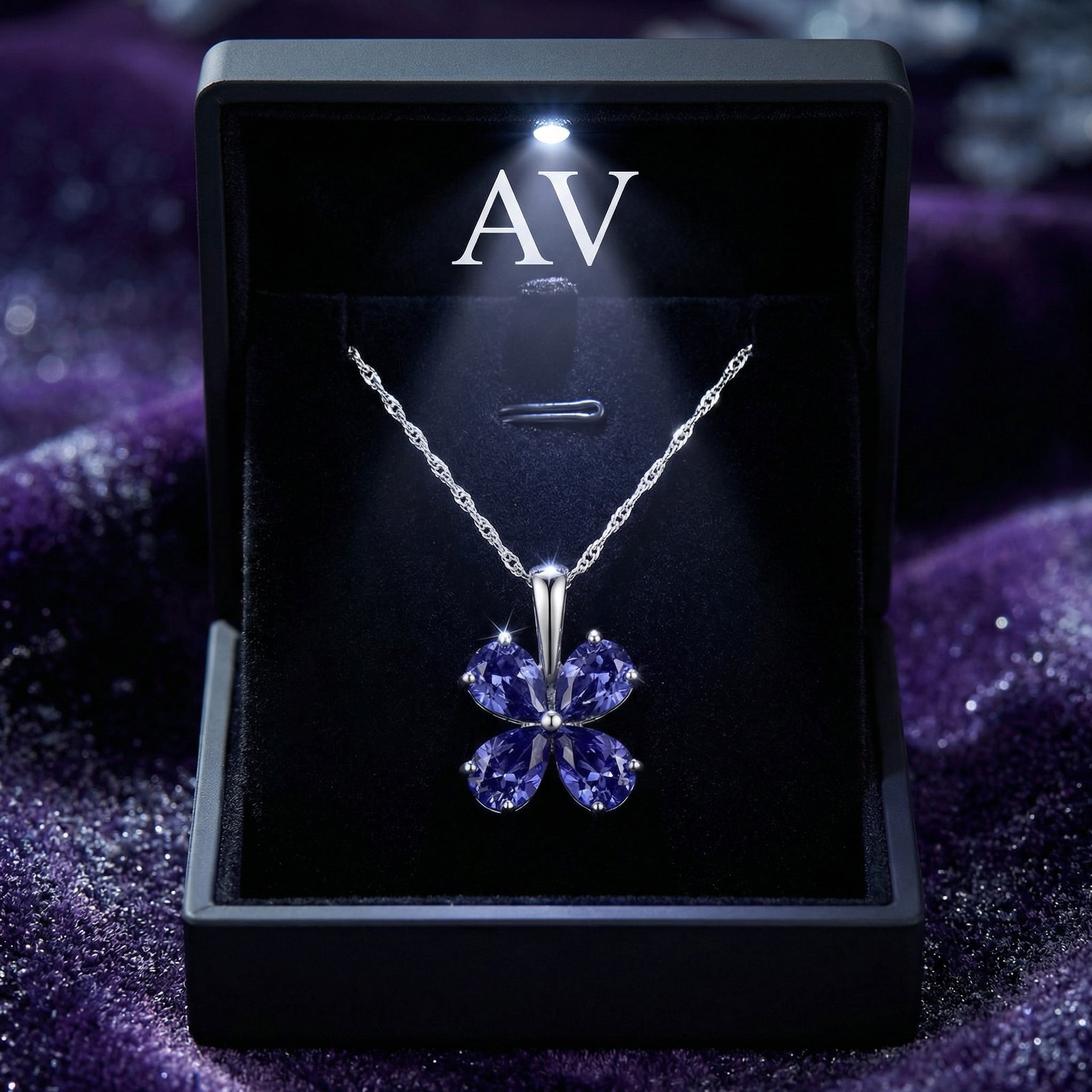 Sidraea Clover S925 sterling silver necklace with pear-cut simulated tanzanite in a black LED-lit gift box.
