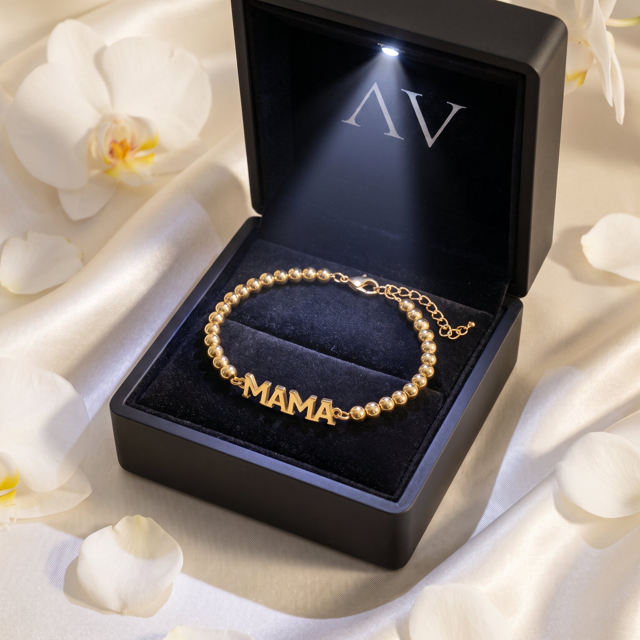 Gold beaded MAMA bracelet in an LED-lit black gift box.