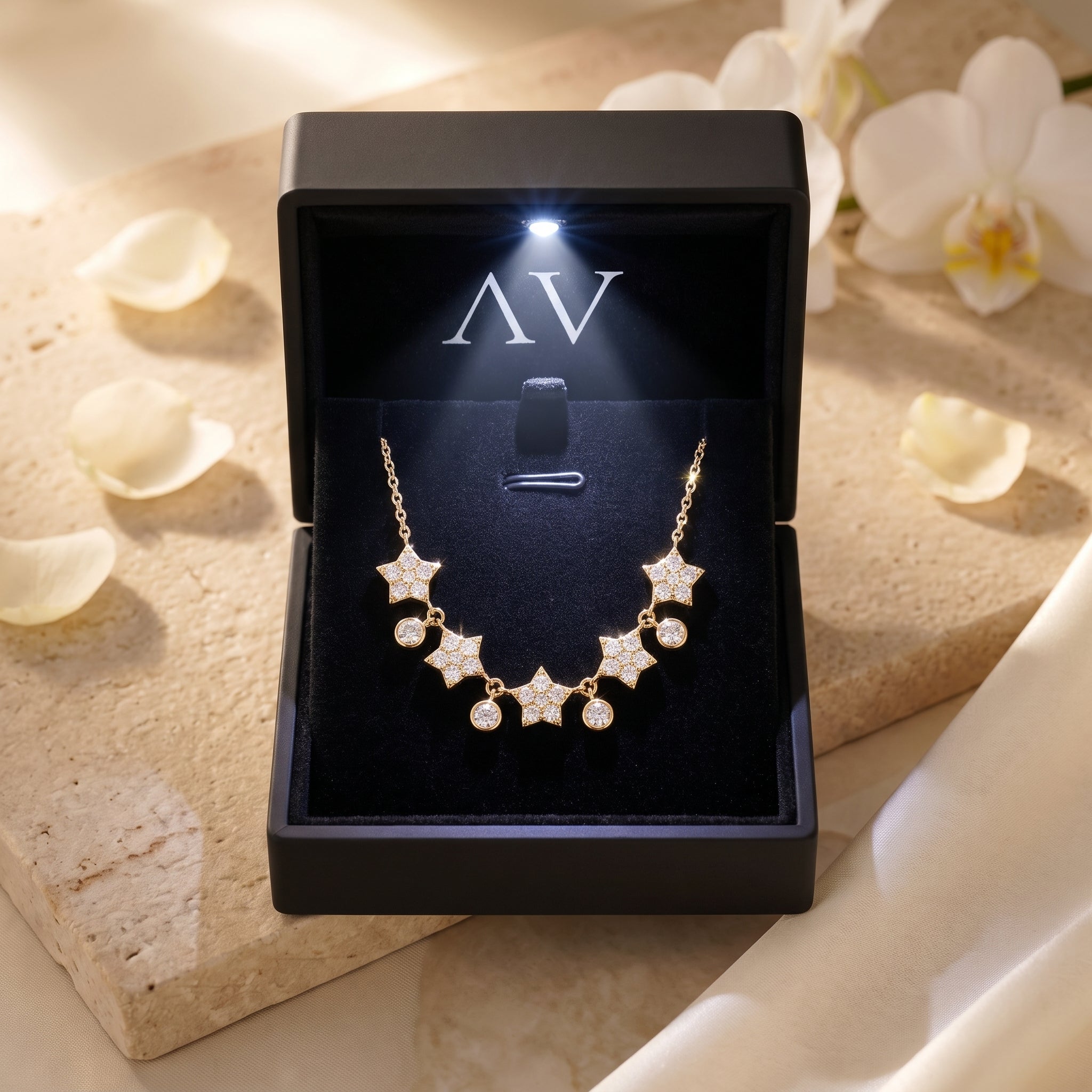 Gold moissanite star pendant necklace presented in a black LED-lit jewelry gift box with AV branding.