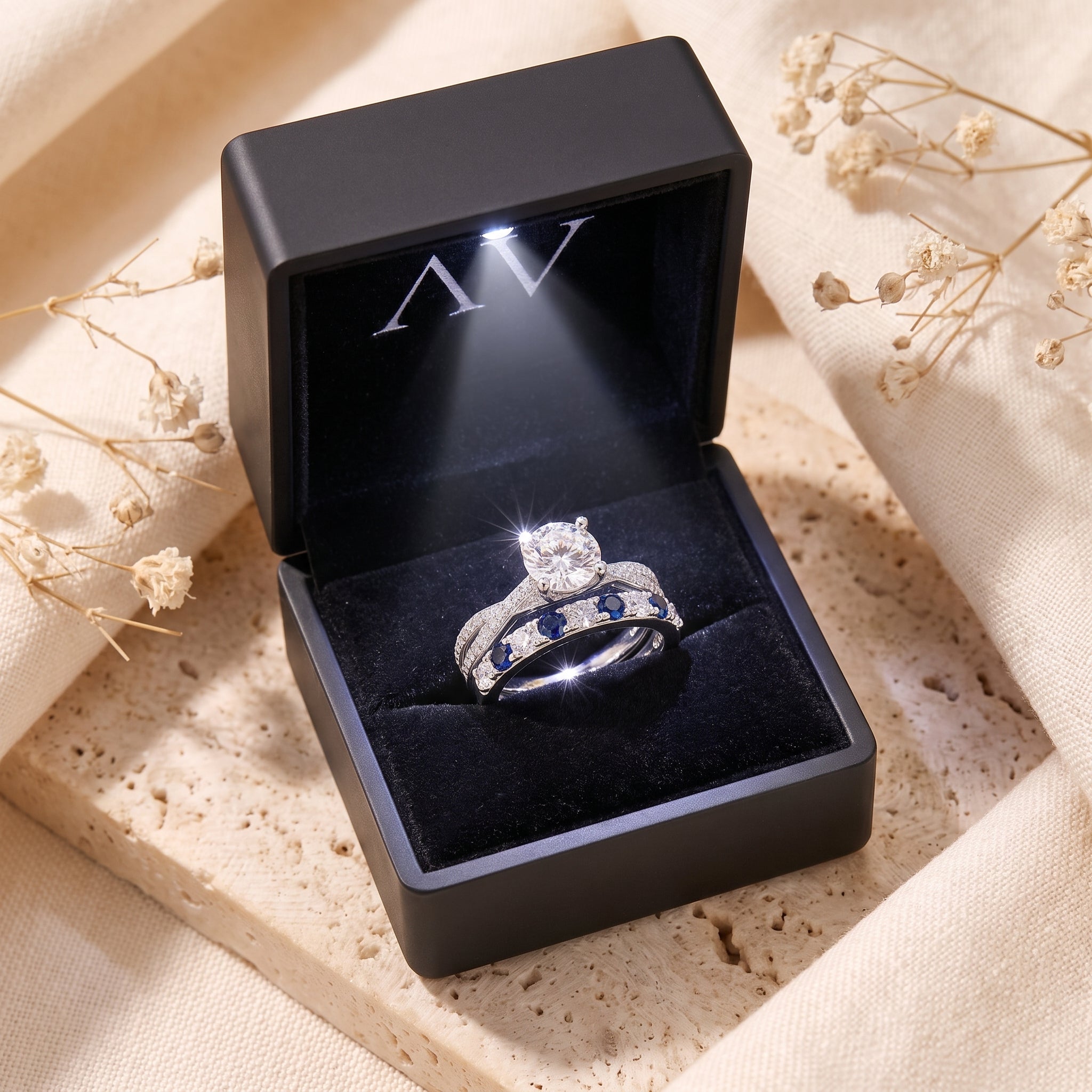 Fiona silver promise ring set displayed in a black LED-lit gift box with floral accents.