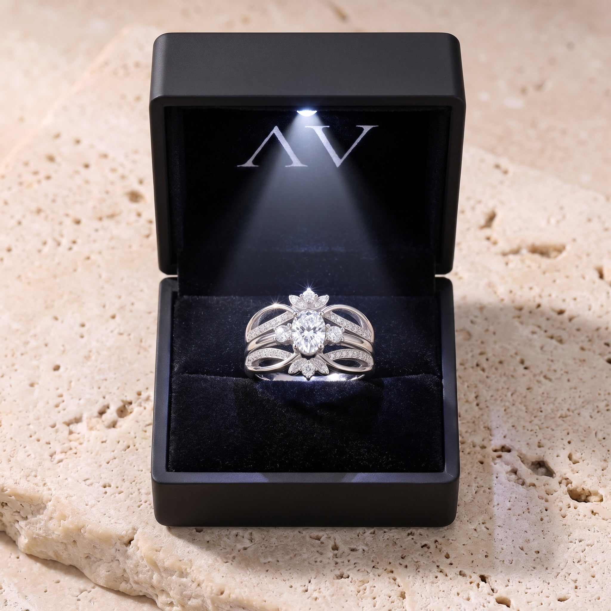 Oval simulated diamond sterling silver ring presented in a black LED-lit jewelry gift box.