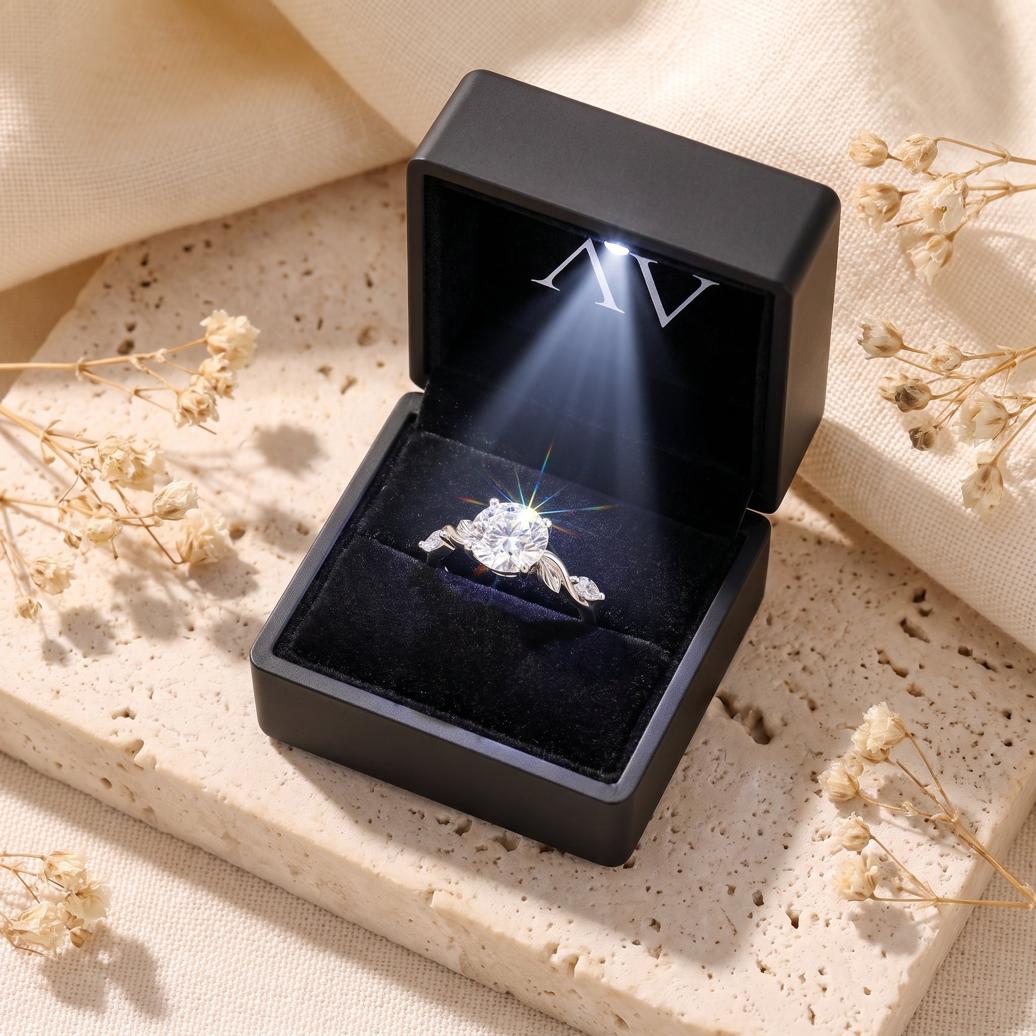 Sterling silver simulated diamond ring inside a black LED-lighted jewelry gift box.