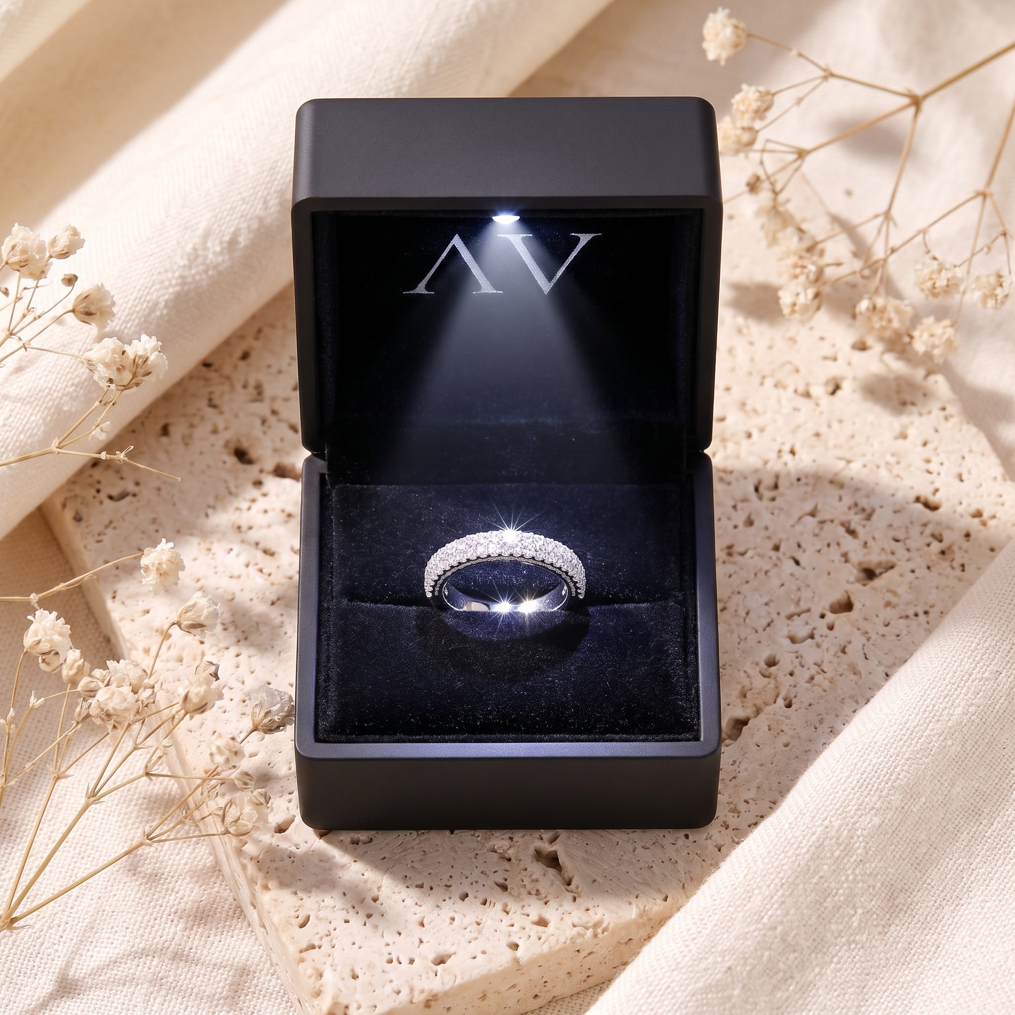 Florentina sterling silver ring with simulated diamonds presented in a black LED-lit gift box.