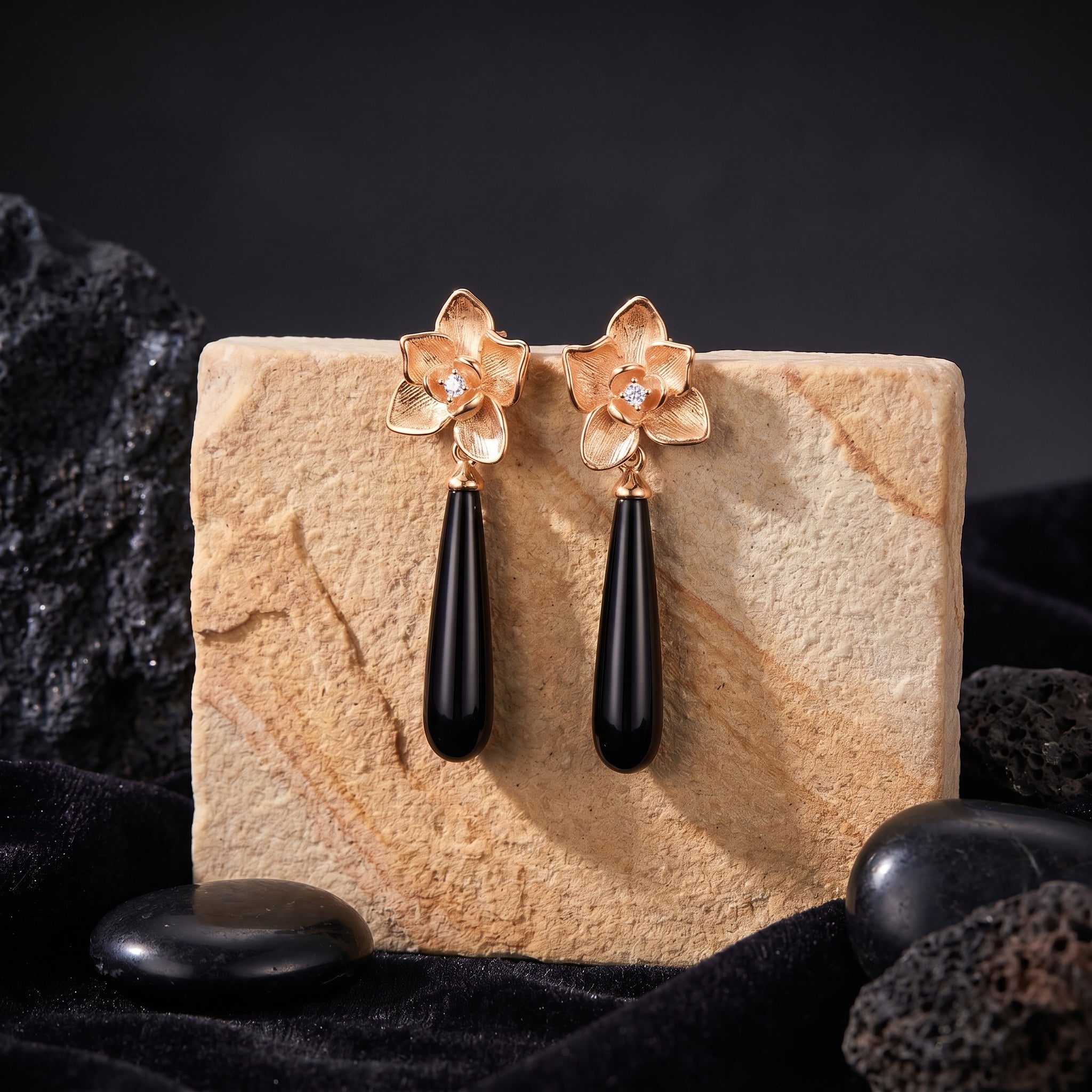 Calla onyx drop earrings in solid rose gold showcasing the floral motif.