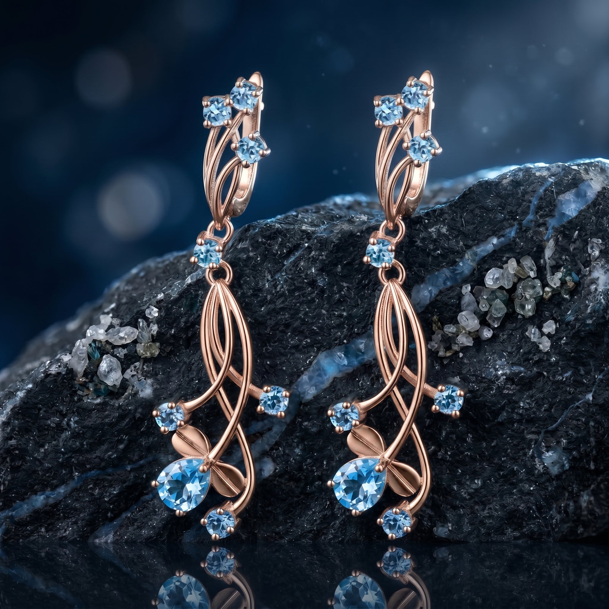 The Oceanis Cascade natural blue topaz drop earrings in solid rose gold.