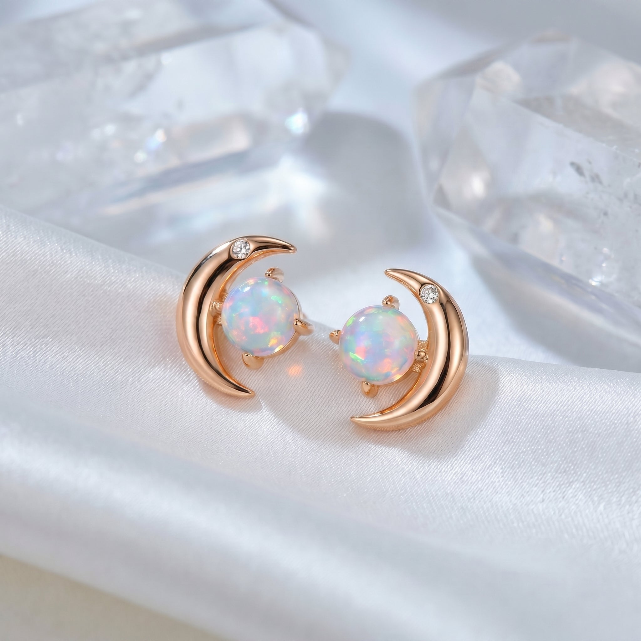 Orianna opal crescent moon stud earrings in solid gold.