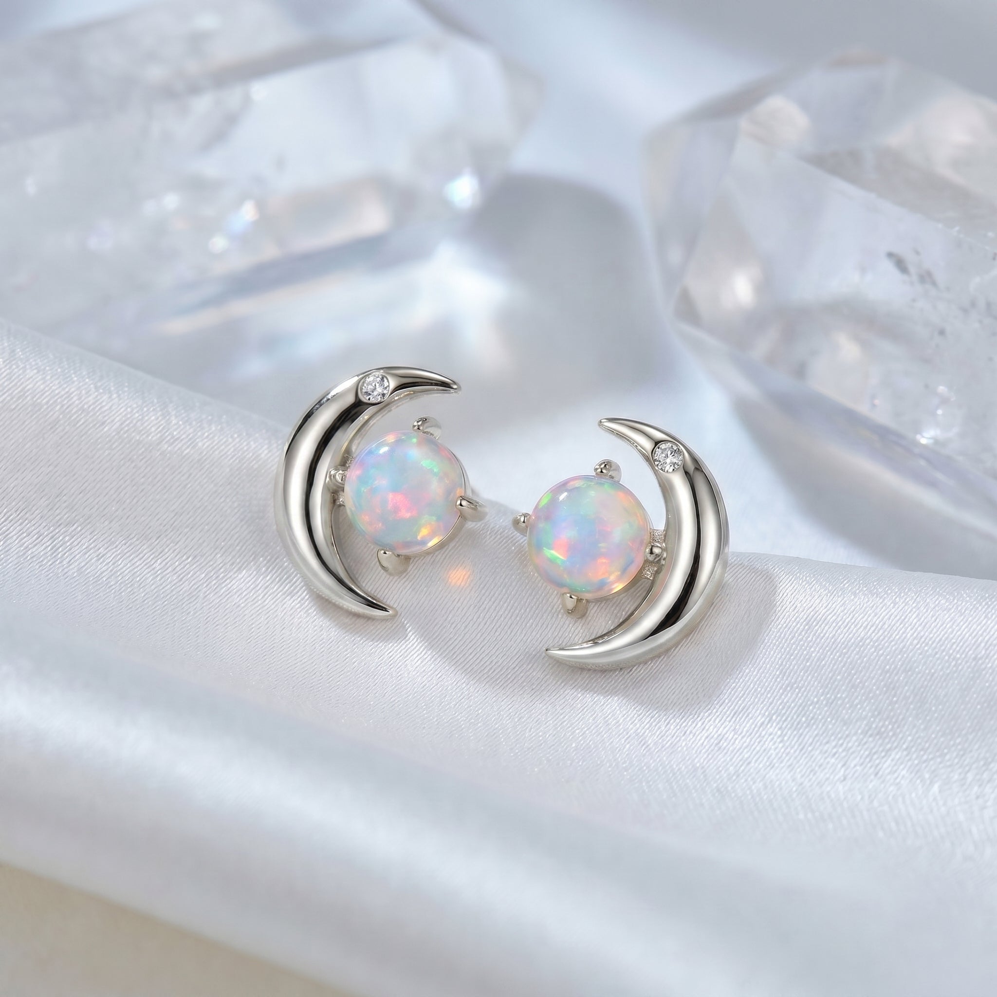 Orianna opal crescent moon stud earrings in solid gold.