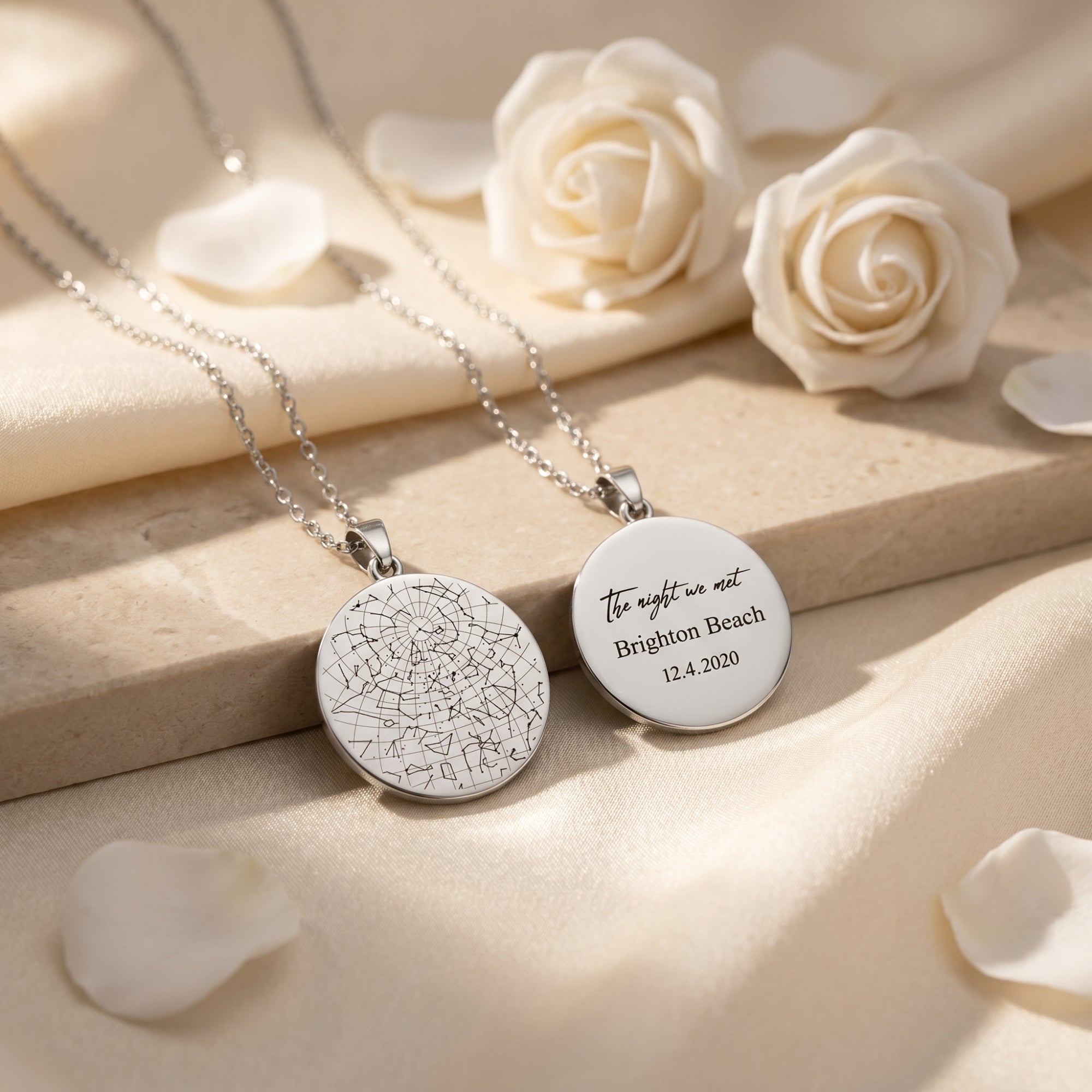 Silver stainless steel Constellara necklaces with star map and text engraving on stone and fabric.