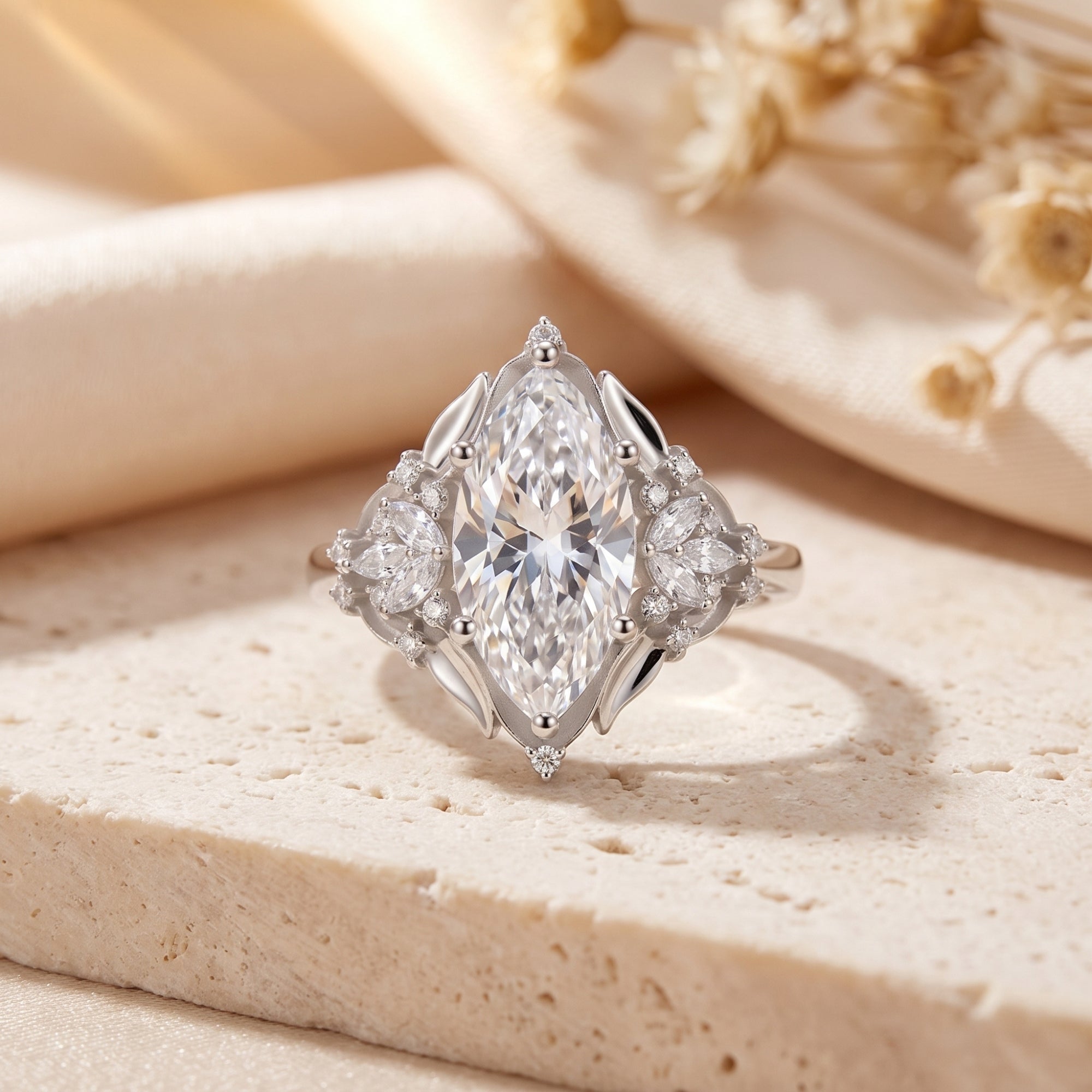 Sterling silver marquise simulated diamond ring on stone with dried flowers.