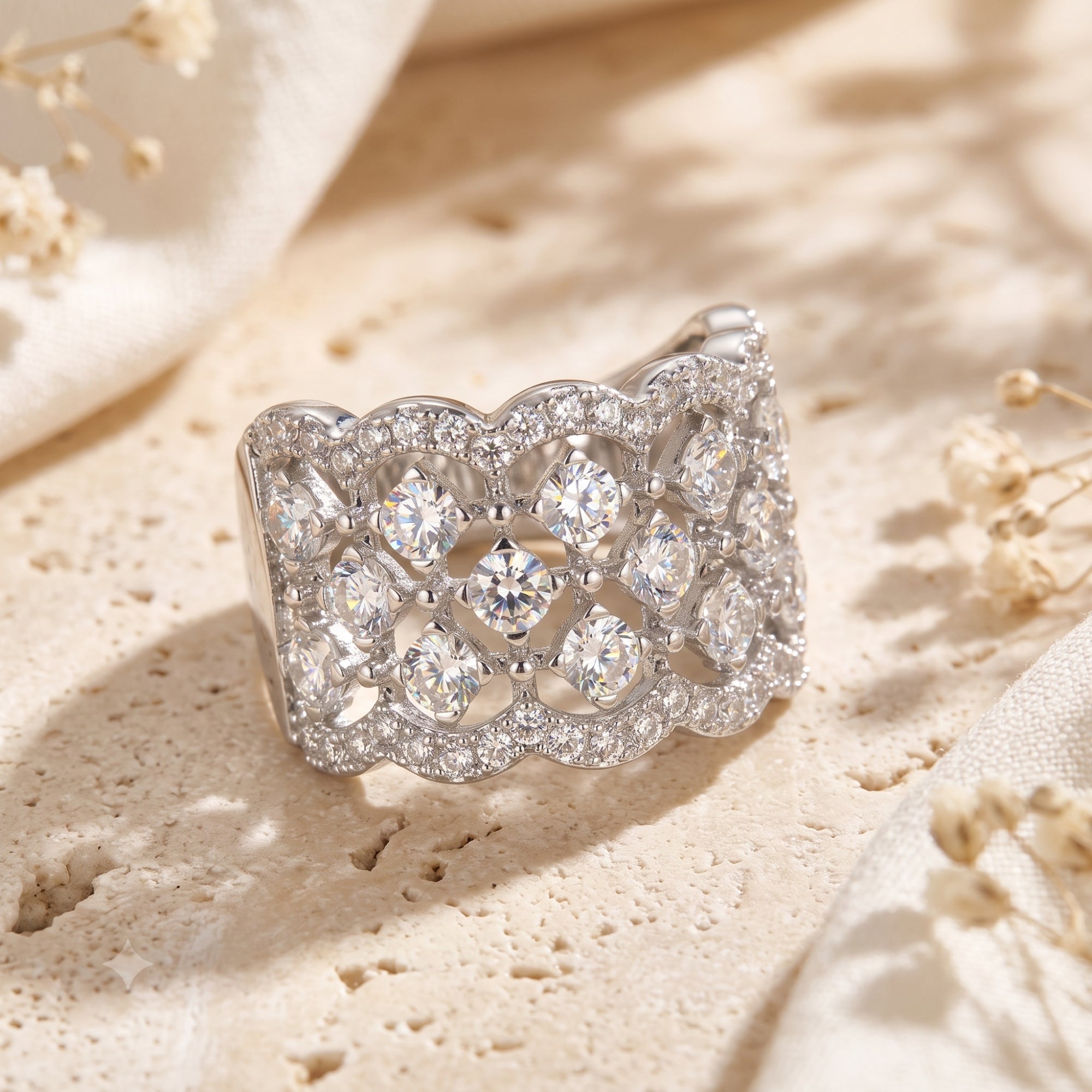 Carisienne sterling silver lattice ring with simulated diamonds on stone with flowers.